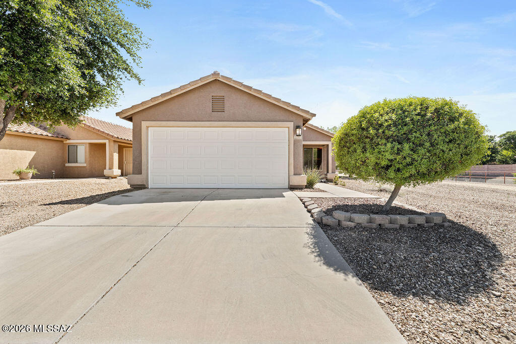 Immaculate home with all new LVP flooring, a new garage door, and a stunning primary bathroom remodel. Situated on a premium lot with plenty of space between neighbors, you will love the freshly landscaped backyard complete with a fully covered patio, artificial turf, and large storage shed. In addition, all appliances are included, making this home move-in ready! Located just minutes to the I-10 and the airport, commuting to the University of Arizona, Davis-Monthan Air Force Base, downtown, or just about anywhere, is a breeze. Additional updates include, newer dishwasher, refrigerator, washer, dryer, toilets, lighting fixtures, and paint. Opportunities like this do not last long - contact us today to schedule your tour!
