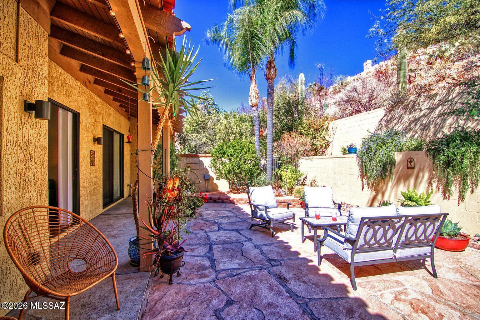 If you're searching for a quiet & peaceful retreat to relax & unwind, this fully furnished El Con Patio Home is the ideal escape—whether for business or pleasure! Thoughtfully designed with sophisticated style & pride of ownership throughout, this home offers a seamless blend of comfort & elegance.Perched near the top of the hill, it's a short walk or drive to the Hilton El Conquistador Resort & Spa, where you can enjoy its world-class amenities. Residents have the option to become members of the Hilton, granting access to its facilities. For ultimate privacy, the backyard is tucked against a walled hillside to the east, & no neighbors behind & enclosed by block walls. Enjoy the 241 SqFt covered patio, a serene outdoor space made for comfort & entertaining. Please call for seasonal rates