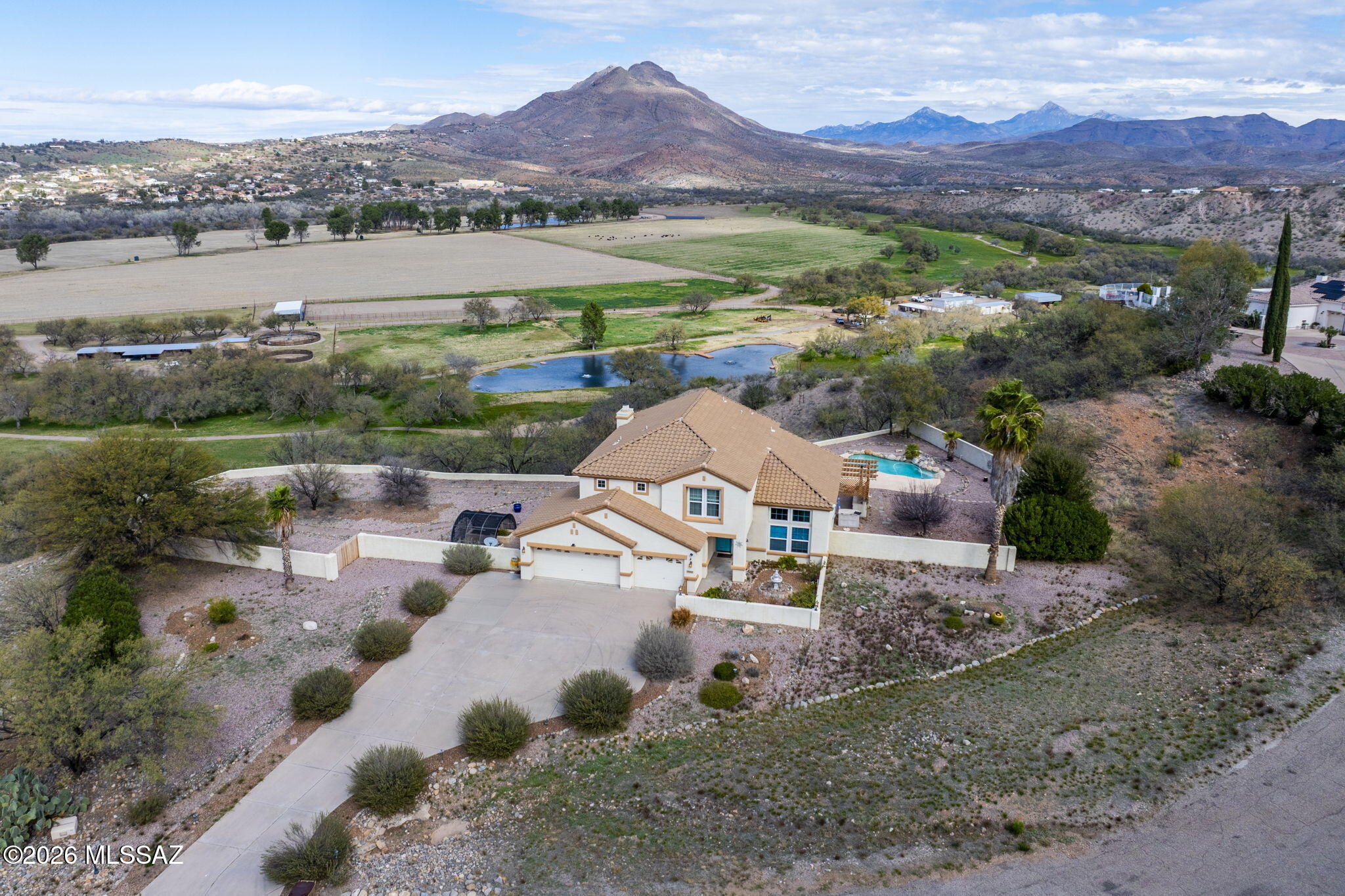 NEW PRICE - Seller offering $5,000 toward buyer closing costs or interest rate buydown. Move-in ready 4-bedroom, 3-bath home on 1.7 elevated acres with no HOA, offering privacy, space, and stunning views of the San Cayetano Mountains. This spacious two-story layout features formal living and dining areas, plus a dedicated den/office--perfect for remote work or flexible living. Recent updates include newer HVAC systems and updated flooring, providing comfort and peace of mind from day one.  The kitchen with stainless steel appliances opens to bright, inviting living spaces filled with natural light. Step outside to your private backyard retreat with a sparkling pool and panoramic mountain views--ideal for relaxing evenings and enjoying Arizona sunsets. A 3-car garage and 1.7 acres.
