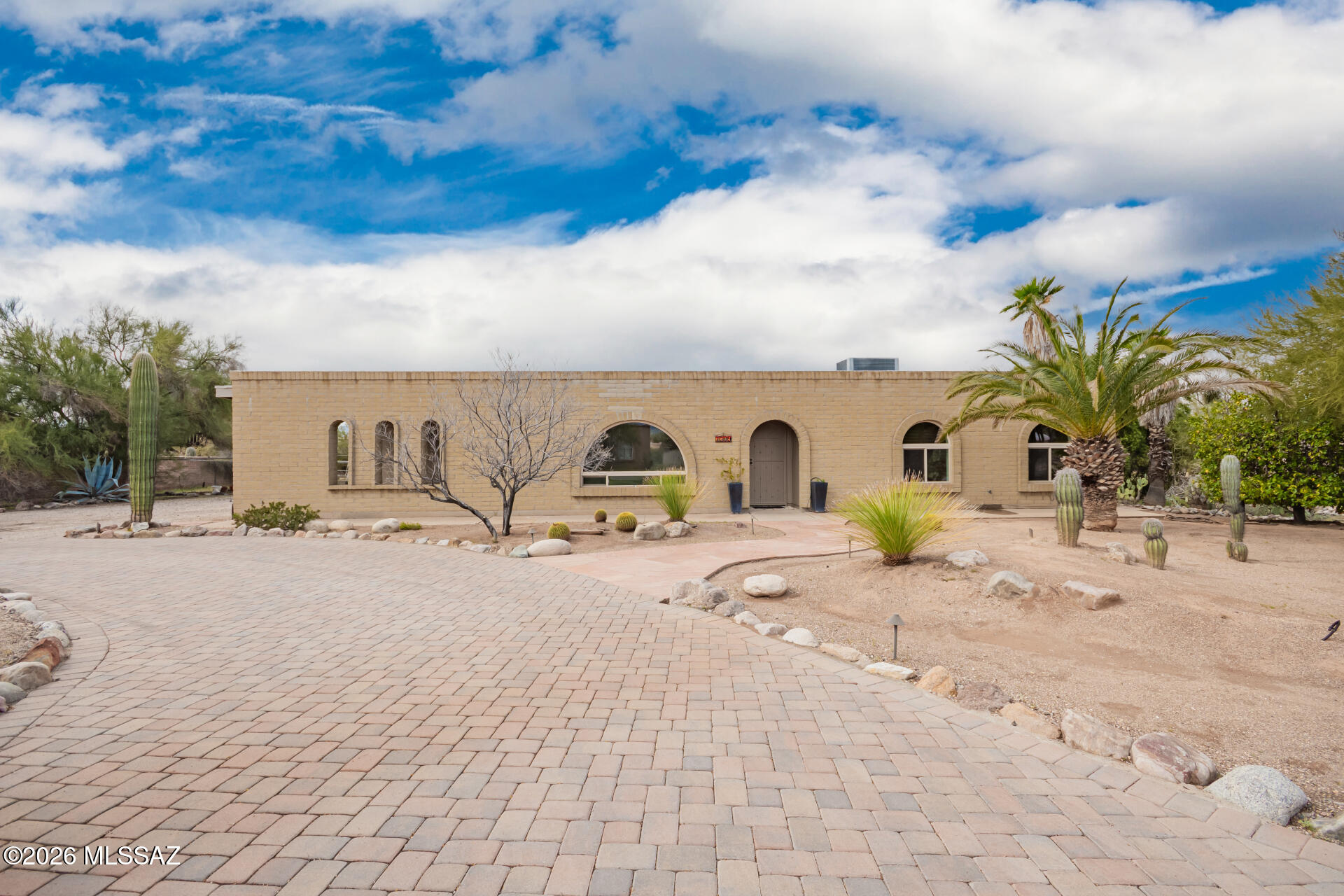 Fantastic opportunity! This delightful 3-bedroom residence plus a bonus room with a separate entrance welcomes you with a tasteful paver driveway, an attached carport, and charming desert landscaping--all situated on a large lot with no HOA.
Inside, the inviting living room features a soothing palette and stylish wood-look flooring. Gather loved ones in the cozy family room, complete with a fireplace. The well-appointed kitchen offers tile counters with a matching backsplash, ample wood cabinetry, stainless steel appliances, and a peninsula with a breakfast bar.
You'll also enjoy a bright Arizona room and an additional bonus room with its own private entrance--perfect for a home office, guest space, or hobby room. The main bedroom includes sliding door access to the patio and a private bathroom with dual sinks.
Step outside to unwind in the spacious backyard, showcasing a screened-in patio, fragrant citrus trees, breathtaking mountain views, and a refreshing pool. This gem truly has it all--make it yours!