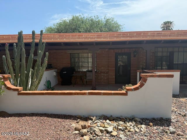 Beautiful wood look tile floors throughout make for easy cleaning! Being set back from the street provides a peaceful outdoor space. The front patio is covered, fully walled and features an iron gate. The kitchen features a pantry/storage closet; the updated shower is very inviting. The community has a pool, laundry facility and plenty of shaded green space to for your outdoor enjoyment.
 *NO GVR, but it is available.* 
Furniture available by SBOS.