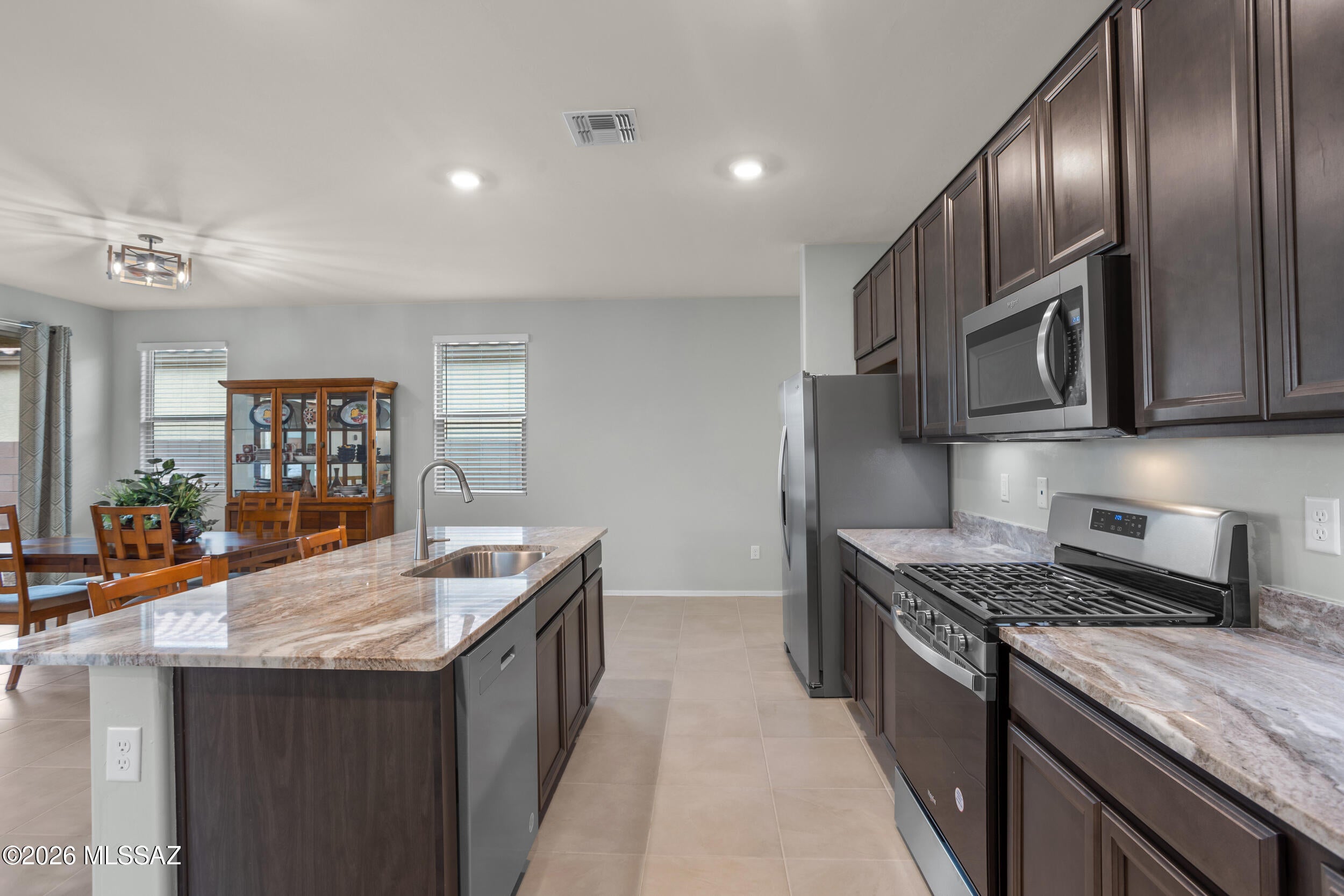 RATES ARE UP-WE'VE GOT YOU COVERED! Seller is offering a 1-year rate buydown with a preferred lender at close of escrow. 
Ask me for details!  
''Top-Rated Vail School & Rincon Views''
Life's Great here at Silver Ridge! Better than New, comes packed with upgrades that make move-in day feel like a celebration. 
Soaring 9-foot ceilings and natural light set the stage, while elegant tile flooring flows through an open-concept layout built for easy living and effortless entertaining. The chef-ready kitchen brings with granite counters, stainless steel appliances, a 5-burner gas cooktop, with views . Plus a flex room, use your imagination.