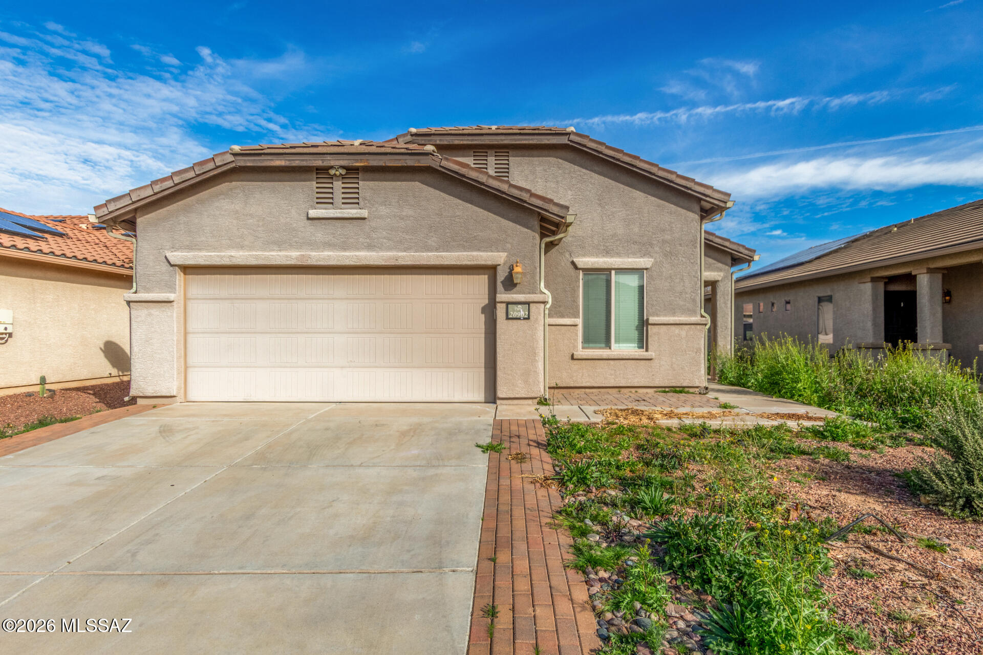 Short Sale Opportunity! Fantastic opportunity to own this charming 4-bedroom, 2-bath residence in Red Rock Village! Discover a spacious living room with high ceilings, blinds, stylish wood-look flooring, and double French doors that lead to the backyard for seamless indoor-outdoor living. The eat-in kitchen comes with ample wood cabinetry, a striking tile backsplash, recessed lighting, essential built-in appliances, a pantry, and a practical serving window with a breakfast bar. The main bedroom includes plush carpeting, a private bathroom, and a walk-in closet for an organized wardrobe. Imagine peaceful afternoons in the backyard, which offers a covered patio perfect for dining al fresco. Don't miss out on this incredible gem!