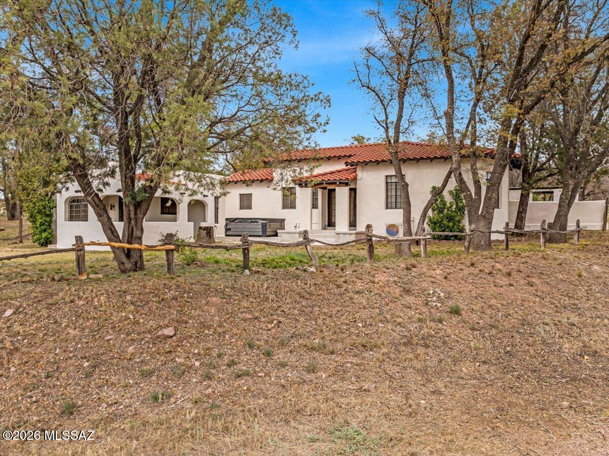 Discover a sanctuary in the Oak Forest where the raw power of nature meets human history. This historic ranch isn't just a property; it's a vortex of beauty that demands to be experienced. 
The estate boasts  7 updated units, anchored by a stunning 2,600 sq. ft. adobe manor. 4 Private wells, Site-sourced oak vigas, original hand-hewn hardware and hardwood finishes, cozy fireplaces and enchanting crannies that evoke a vibe long forgotten.
Outside, 80 acres of pristine land are bordered on two sides by State Land, creating an infinite backyard accessible through your own private gates. The property is fully equipped for equestrian use with a new tack room and stallion arena.  Potential commercial uses here also. Outbuildings have been used as short term rentals and for various enthusiast group stays, 70% are turn key and ready for guests.  Enjoy the seasonal flow of Turkey Creek and the daily parade of local wildlife. While currently a beloved Guest Ranch, the possibilities are endless--from agricultural pursuits to private nurseries or simply your family compound away from it all.