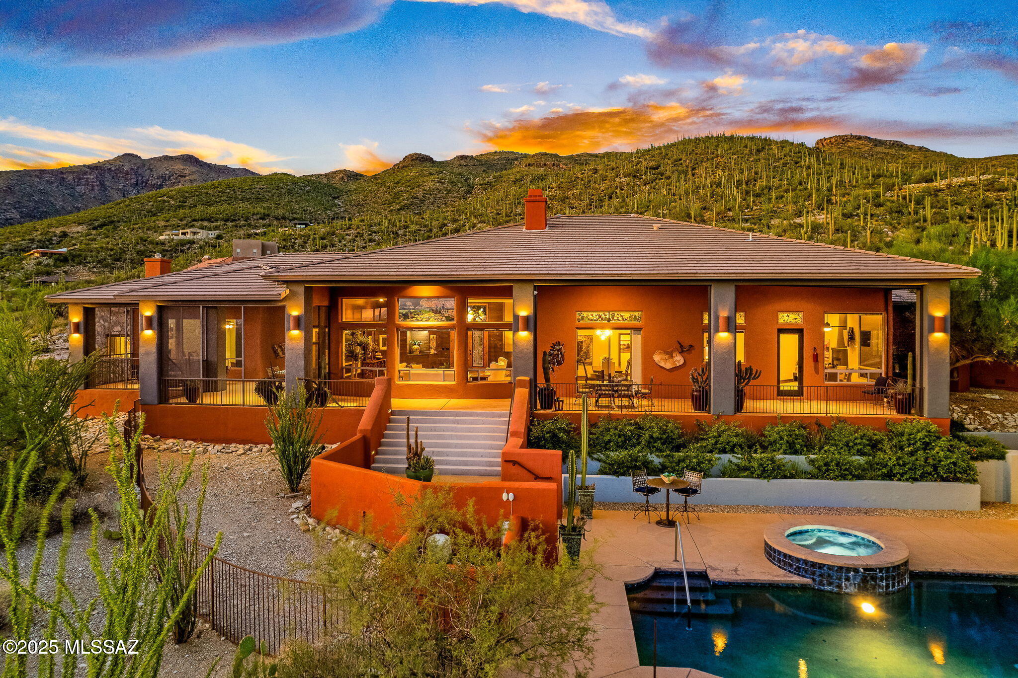 Perched approximately 2,900 feet above sea level on a private 3.3-acre lot within gated Mira Vista Estates, this contemporary Southwest retreat captures sweeping mountain vistas and twinkling Tucson city lights. Designed for seamless indoor-outdoor living, the residence offers over 5,000 square feet of living space, including a detached casita/pool house. Dramatic walls of glass, soaring custom ceilings, and rich natural finishes frame breathtaking desert sunsets throughout. The gourmet kitchen features professional-grade appliances and opens to wonderful entertaining spaces with multiple fireplaces. Resort-style outdoor living includes a sparkling salt water pool & spa, expansive patios, and thoughtfully landscaped desert gardens. 2 New Water heaters. NEW ROOF being installed March 2026. Step outside to immediate access to outstanding hiking opportunities, both on-trail and off-trail, with neighborhood terrain offering a rewarding challenge for outdoor enthusiasts. Equestrian amenities are nearby, including boarding options and access to desert riding trails in the Tanque Verde Wash and Saguaro National Park.

Mira Vista Estates is a secluded, gated community of only 23 homes with generously sized lots, offering exceptional privacy, tranquility, and a true sense of an exclusive retreat. Conveniently located near grocery, pharmacy, hardware, banking, restaurants, and popular local coffee and bakery destinations. Located in the respected and sought after Tanque Verde School District. The Tucson area is also renowned for its birdlife, with over 500 species, providing daily opportunities to enjoy desert wildlife, including quail and roadrunners. 
A rare combination of elevation, privacy, natural beauty, and luxury living at the top of Tucson's Tanque Verde Valley.