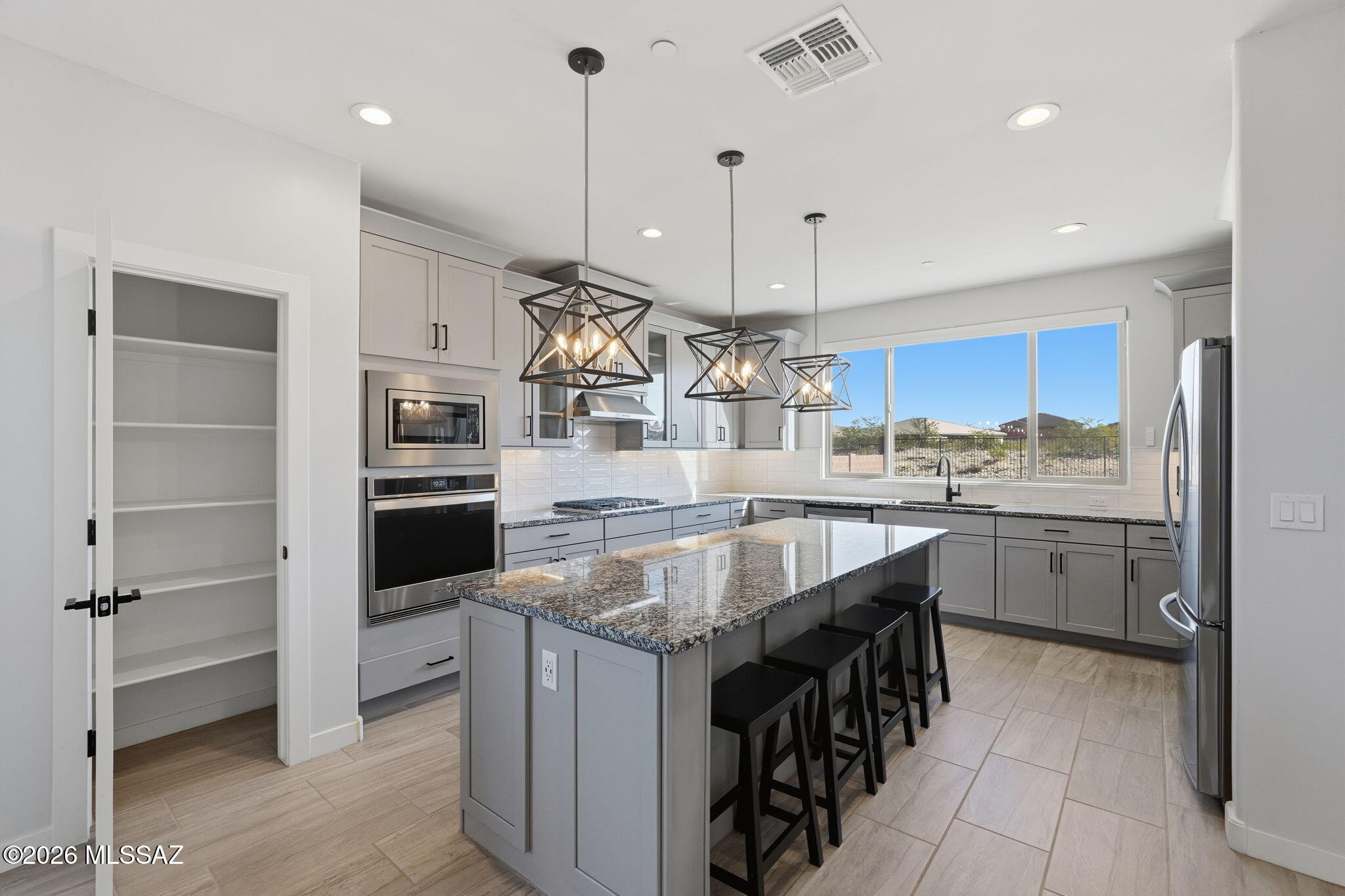 ''It Feels Like Home'' The heart of the home is its beautifully designed kitchen with style and function. Granite countertops, extended-height cabinetry, elegant finishes, and an ''ENORMOUS PANTRY'' offering exceptional storage for effortless entertaining.Tucked away on a peaceful cul-de-sac in Madera Highlands Village, this new retreat invites you to breathe deeply, and love where you live. Backing to protected open view with no future development behind, every sunrise and sunset feels a little more private, a little more peaceful, and entirely your own.
Designed with comfort and connection in mind, the uniquely split floor plan creates the perfect balance of togetherness and personal space. The spacious primary suite feels like a private sanctuary, complete with a spa-inspired bathing Set on an Oversized Premium Lot, the backyard is filled with possibilities. Imagine evenings under the stars beside a future pool, outdoor kitchen, playset, or desert-inspired retreat designed exactly the way you envision it.
Inside, every detail reflects modern elegance and thoughtful upgrades, from custom flooring and elegant lighting to remote-controlled blinds, an oversized laundry room, and epoxy garage floors that add a polished finishing touch.
This is more than a home* it's a place to create memories, gather with the people you love, and enjoy the beauty of Arizona living for years to come! "Welcome to Your New Home"