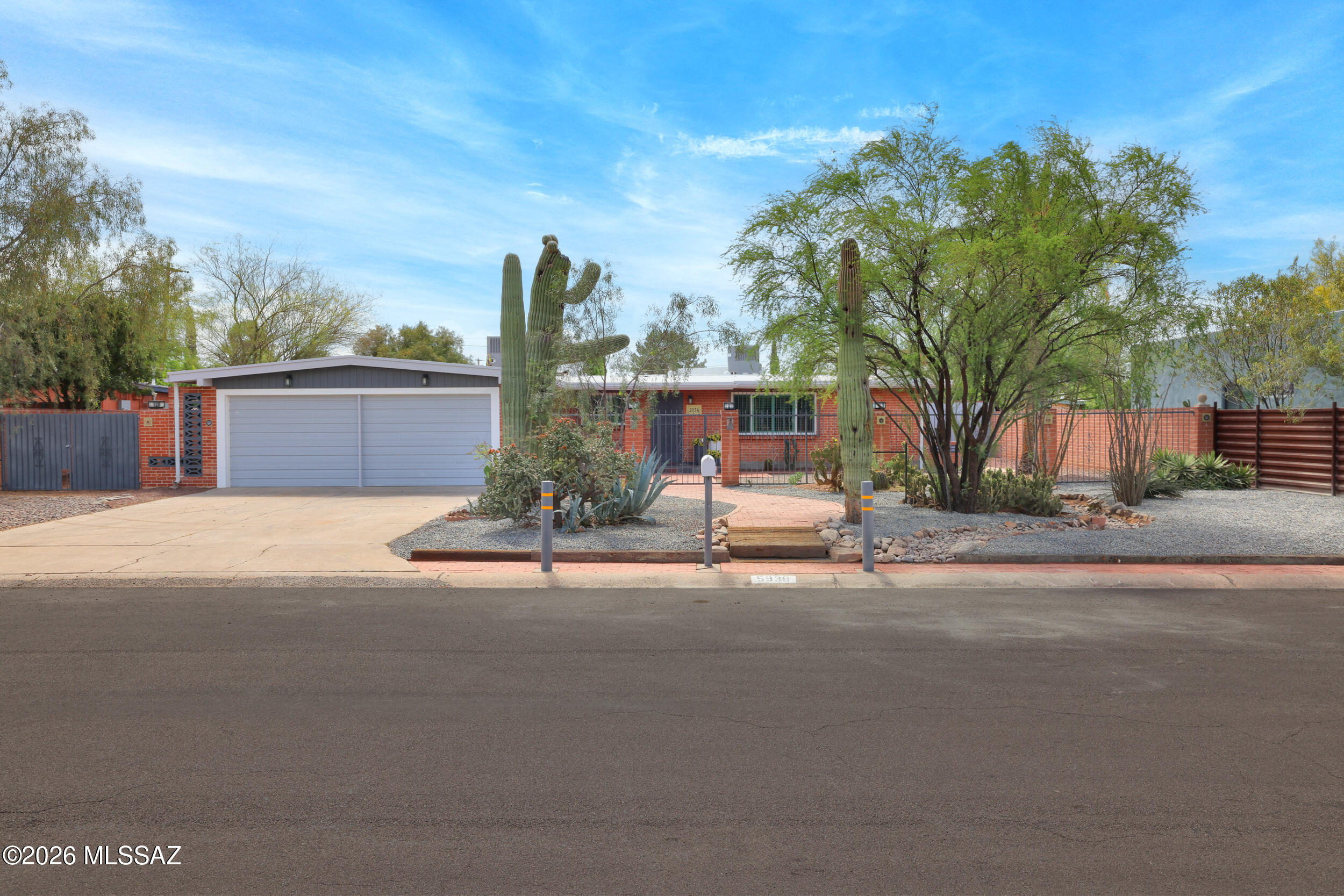 Midcentury Jewel! Over $100,000 in improvements. Updated kitchen and bathrooms. New double pane windows. New A/C units in main house and family room. New split units in workshop/garage and office/studio. New appliances in kitchen. Roof recently recoated. The 700sf addition is a homeowner's dream with newer vinyl flooring, bar and fireplace. Two car garage that opens from the alley has workshop and air conditioning. The detached 150sf office/studio could be a 4th bedroom. Desirable central neighborhood, appealing street presence.