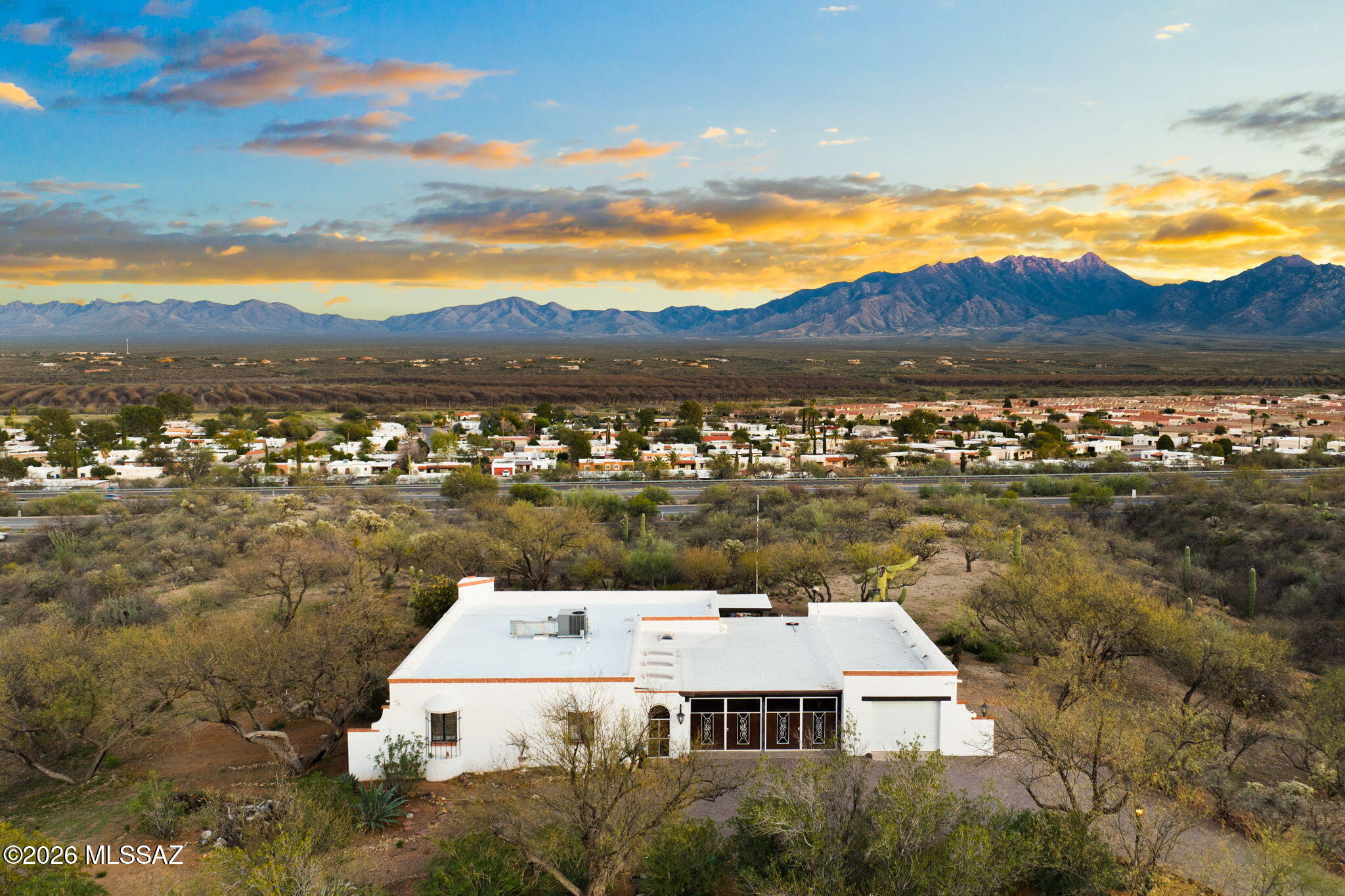 Set on nearly 3.9 acres in Green Valley, this property offers a rare blend of space, privacy, and flexibility. Even more compelling, it is not located in an age-restricted community and has no GVR membership, giving you complete freedom in how you live, use, or invest in the property.

Perched on an elevated homesite, the property captures sweeping mountain views and a sense of openness that defines true desert living. The main residence spans 2,036 square feet with 3 bedrooms and 2 bathrooms, offering a comfortable, well-designed layout that feels both open and inviting. Just steps away, a detached 266 square foot guest house adds valuable versatility, ideal for extended stays, a private workspace, or hosting guests with ease. The land itself is where this property truly stands apart. Nearly 3.9 acres of usable desert create a peaceful buffer from the world, with ample room for expansion, outdoor living, or simply enjoying the surrounding landscape. Whether you envision additional structures, curated outdoor spaces, or wide-open desert views in every direction, the possibilities here are exceptional.

All of this, while still being conveniently located near Green Valley amenities, shopping, and quick access to I-19 for an easy drive to Tucson or the international border.

Opportunities like this--offering elevated acreage, mountain views, a guest house, and no age or membership restrictions--are increasingly rare. This is Green Valley living on your terms.