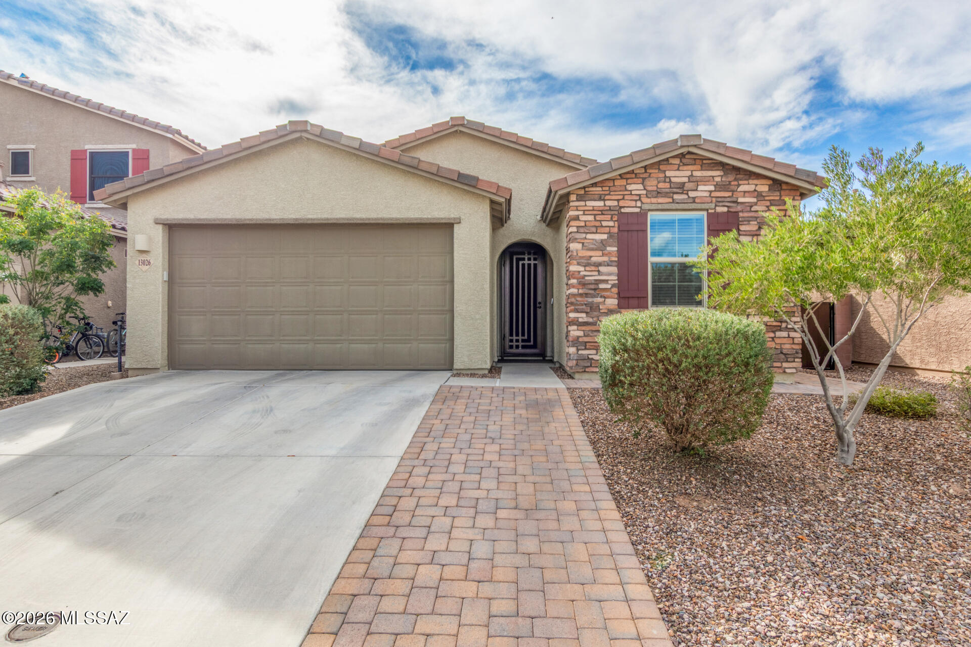 Better than new construction! Enjoy 45k in backyard amenities without the expense and time. The backyard oasis flows seamlessly from the living room and features a full length covered paver patio, luxury spa with pergola, multiple sitting areas and beautiful landscaping. This gorgeous view lot has a wide open feel in the gated community of Rocking K.

The home features 3 bedrooms, 2 bathrooms, and a 2.5 car garage with storage racks already in place. New interior paint (2025). Fantastic curb appeal with a brick accented facade, extended paver driveway, and a custom wrought iron security door.

The desirable open floor plan sets the stage for entertaining friends and family. Other key highlights include the expansive kitchen fully equipped with SS appliances, dual ovens, recessed lighti a gas cooktop, abundant cabinetry, granite countertops, a breakfast bar for casual dining in addition to a dedicated dining space.

The large primary bedroom features a walk-in closet, an ensuite bathroom with dual vanities and a chic glass tiled shower with sitting bench.

Don't miss out on this ready to enjoy home and the many upgrades it has to offer!