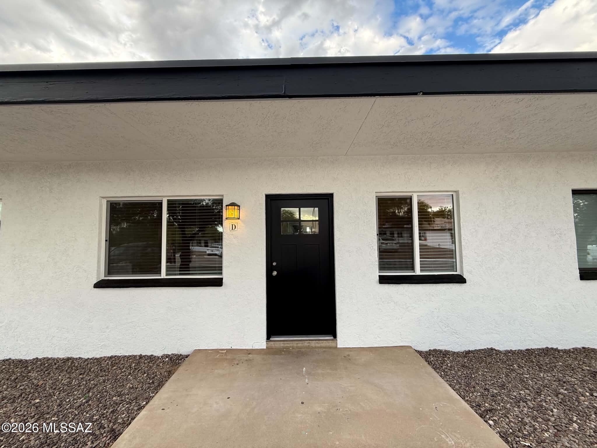 Charming 2 bedroom, 1 bathroom home offering approximately 800 sq. ft. of comfortable living in a quiet, well-maintained community in central Tucson. This inviting unit features wood-look vinyl flooring throughout with no carpet, creating a clean and low-maintenance living space. The functional kitchen comes equipped with a refrigerator, stove, oven, microwave, dishwasher, and disposal, while the in-unit washer and dryer provide added everyday convenience. Enjoy year-round comfort with air conditioning, ceiling fans, and heating. Step outside to your own private fenced backyard, perfect for relaxing or spending time outdoors. Residents also have access to a refreshing community pool. Conveniently located near the University of Arizona, shopping, dining, parks, and major roadways. This pet-friendly home offers an excellent combination of comfort, convenience, and location. Schedule your showing today!