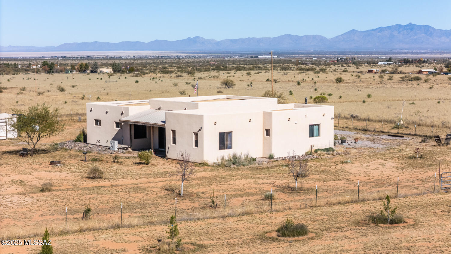 HUGE PRICE REDUCTION on this beautiful, large, 3BR, 2BA, luxurious home, boasts a 735' deep private well, oversized garage, with a cooled wine room, large walk-in pantry, spectacular kitchen, lovely living areas, screened-in porch, and one of the most spectacular views of Cochise Stronghold that you'll find! This home is built with structural insulated panels, which makes for a highly energy-efficient home. Dark night skies for stargazing, wildlife galore, and peaceful surroundings. Very nice outbuildings, 8'x40' storage container, frame for a large greenhouse, and pens for your animals! A rare opportunity to own a beautiful and well built home on 5 lots, totaling 5.45 Acres! So much beauty and elbow room, in doors and out, priced well, with indescribably spectacular views!
