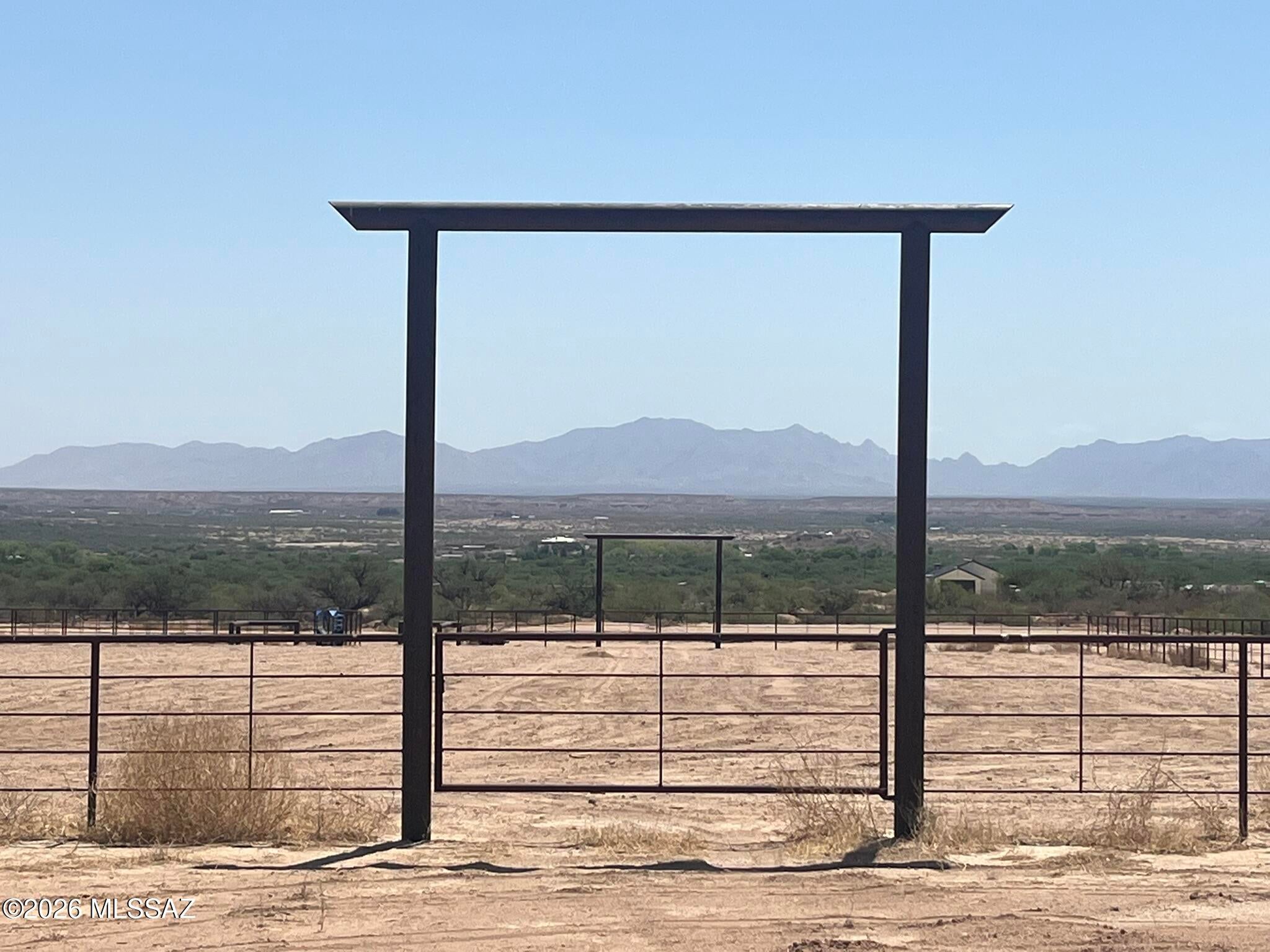 20 Acres located in Benson AZ with 1/4 mile of Highway 80 Frontage and a 285'x165' Roping Arena. The property is zoned Commercial (B2 zoning), and offers a Large Equipment or Hay Barn, large professional roping arena with large sorting pens, a high volume (75 gallon per minute) well, 3000 gallon tank, water stand, 400 Amp electric service and many acres of leveled parking. This parcel has been split into 2 lots. Lot #2 is 6 acres of HWY 80 frontage with a well share and is available for sale separately at $147,516. Co listed with Scott Thacker, Stronghold Ranch RE. Owner is a licensed Real Estate Broker in AZ.