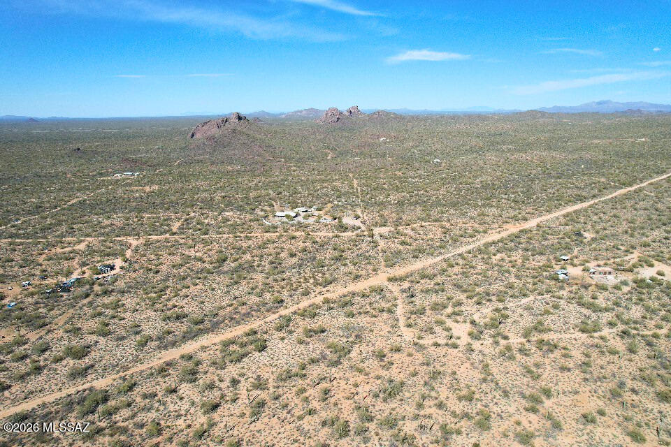 Enjoy quiet desert living on 5.21 acres along E Crested Saguaro Ln in Marana, AZ. This General Rural zoned property offers open space, distant mountain views, and natural desert terrain with small bushes, cactus, scattered trees, and gentle north-to-south slope. Manufactured, modular, and mobile homes are allowed, with no minimum square footage requirement to build. Access is just under 6 miles from the main paved road by maintained dirt roads, accessible by most vehicles in dry conditions. Power lines are near/on the property, and high-pressure gas line signs are nearby. The area has spread-out homes, nearby neighbors, and a peaceful rural setting about 40 minutes from Tucson Premium Outlets.