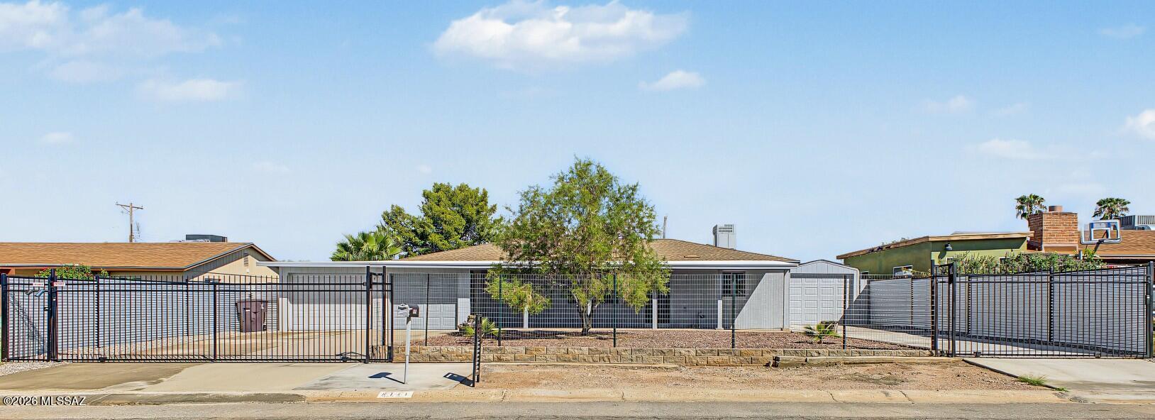 Exceptional quality, modern comfort, and over $60K in recent capital improvements in central Tucson! Beautifully updated, this turnkey home features a chef's kitchen complete with new Royal plywood cabinetry featuring dovetail construction and soft-close hardware, sleek granite countertops, and a full set of new appliances, including washer and dryer. Additional interior highlights include updated PEX plumbing throughout, modern lighting, and ceiling fans. Mechanical and efficiency upgrades abound with a Tankless gas water heater, a high-efficiency Bosch inverted heat pump package unit, an updated roof (2019) with a recoated porch (2025), and a $10K complete water and sewer line restoration featuring epoxy relining with a lifetime warranty.

The home's exterior is wrapped in a full Johns Johns Manville AP Foil R-13 rigid foam board insulation system over the brick structure, complete with custom stucco, an acoustic/protective rubberized coating, 22" blown attic insulation, and 5 energy-efficient double-pane windows for ultimate year-round comfort and low utility bills. Fully secured with 3 locking gates and perimeter fencing, this property also offers double and single driveways, plus an expansive garage setup with 4 automatic overhead doors with openers, updated 15A outlets, and pedestrian access. Unmatched durability, efficiency, and move-in-ready style!