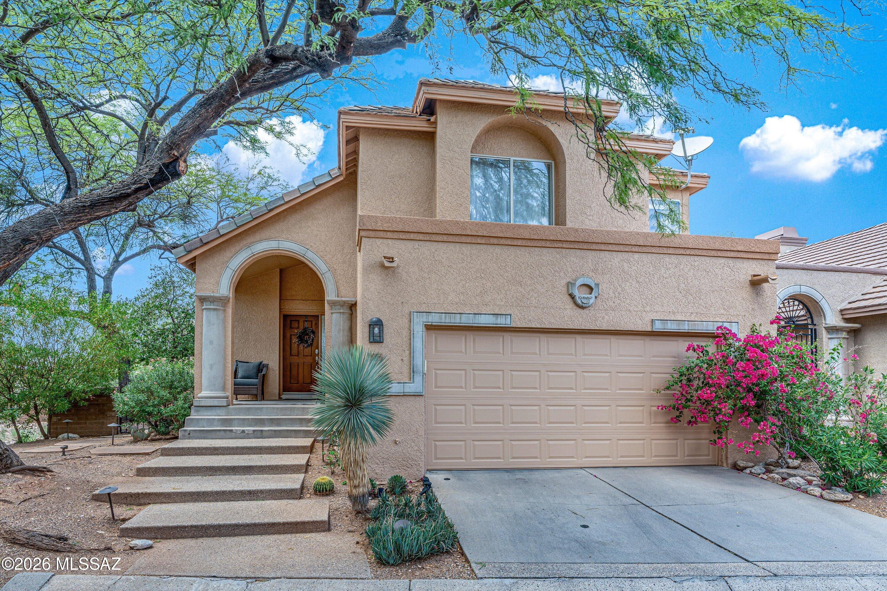 Perfectly positioned on one of the community's most desirable lots, this beautifully maintained home offers the ideal blend of breathtaking Catalina Mountain views, golf course living, and exceptional privacy. A natural desert buffer and cart path create the perfect separation between the backyard and the green, allowing you to enjoy all the scenery without golfers feeling like they're right outside your patio--and without worrying about stray golf balls hitting your windows. It's truly the best of both worlds. Inside, soaring vaulted ceilings and expansive windows flood the home with natural light. The thoughtfully designed floor plan features inviting living spaces, spacious bedrooms, and a beautifully updated kitchen, creating a home that's move-in ready while still offering opportunities to add your own personal touches.

Step outside and you'll discover what truly sets this property apart. The beautifully landscaped backyard feels like your own private desert retreat, shaded by mature trees and surrounded by lush desert landscaping. The backyard gives you plenty of room to enjoy morning coffee, evening dinners with friends, or simply unwind while watching the Catalina Mountains glow at sunset.

Whether you're hosting loved ones on the patio, enjoying the peaceful surroundings, or taking advantage of the golf course just beyond your backyard, this home offers the relaxed Arizona lifestyle you've been waiting for.