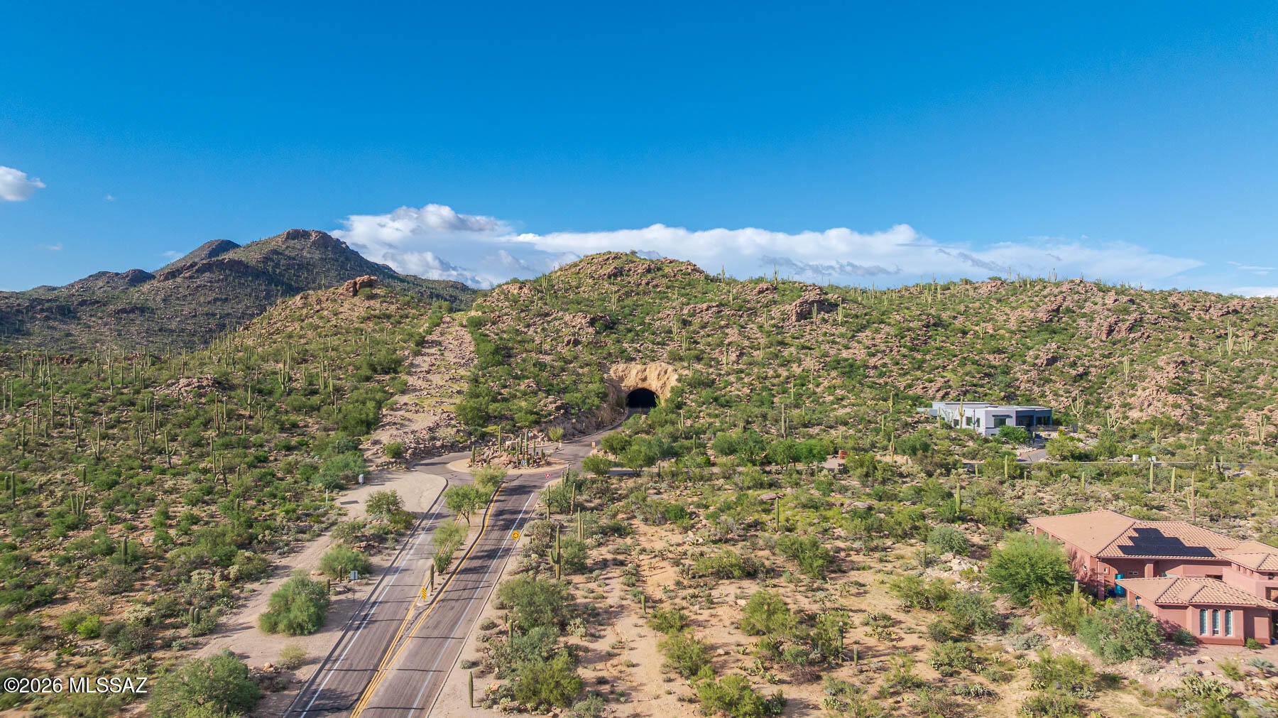 Situated in the hills of the Tortolita Mtns adjacent to Saguaro Ranch, this heavily vegetated lot of 3.32 acres is located in a gated custom community of 12 lots. Panoramic mountain views in all directions and valley lights to the south! The gently sloping lot is an easy build at the end of a cul-de-sac. Versatile lot placement helps to maximize your view! Choose your builder and build when you're ready. Surveyed and staked in 2022. Updated Design Guidelines and CCR's upon request. Utils to the lot line. Tucson water. Septic required. Minutes away from shopping, restaurants, services, the Ritz Carlton Hotel and many golf courses.  BE SURE TO LOOK AT THE FAB VIDEO OF THE TBB AREA!