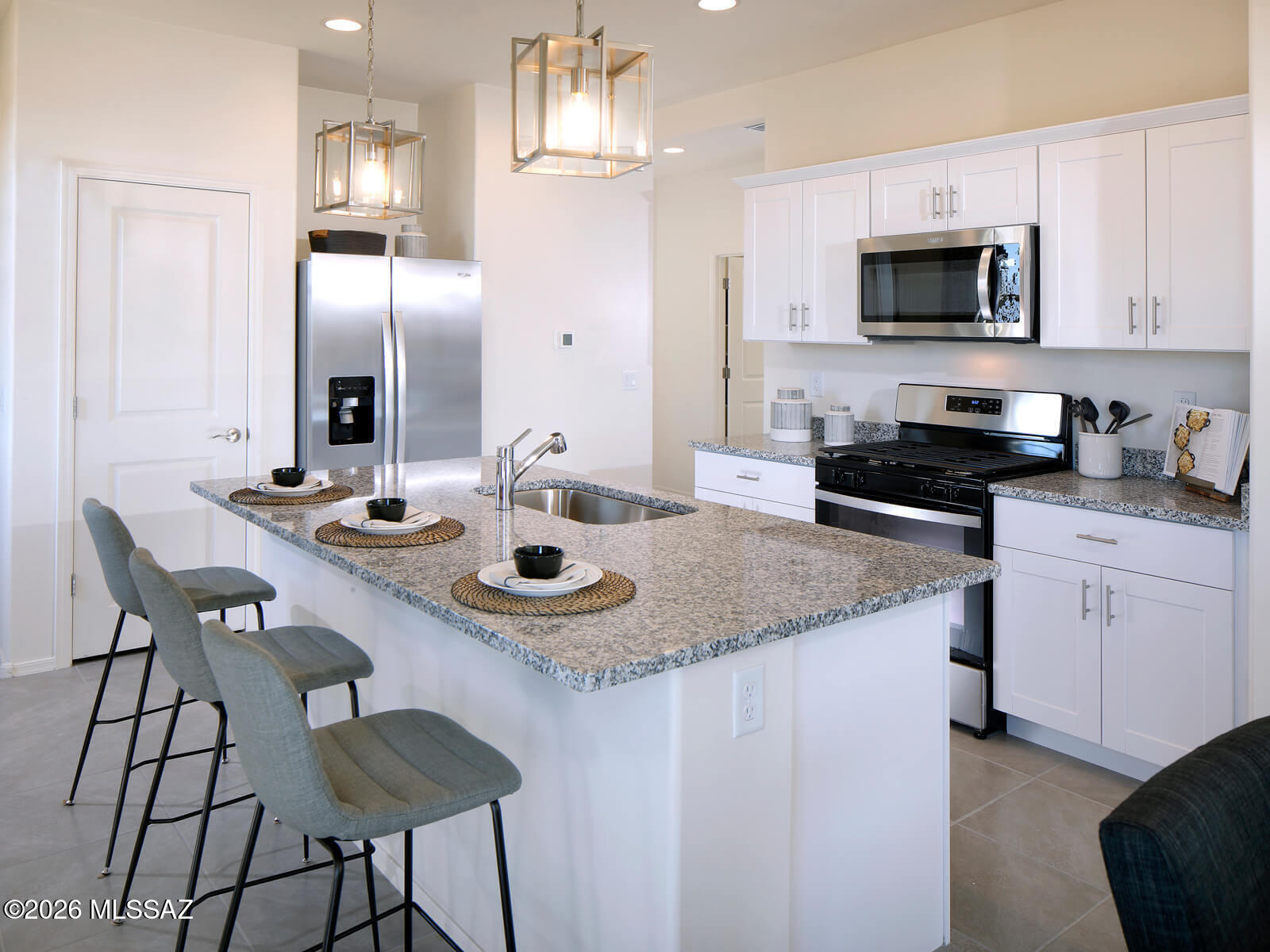 Discover this inviting home with a thoughtfully designed open-concept layout featuring 3 bedrooms and 2 bathrooms. A versatile flex room off the kitchen adds extra space for a home office, playroom, or hobby area. The spacious primary suite includes a generous walk-in closet to fit your entire wardrobe. Located in the growing Mandarina community in Marana, residents will enjoy future amenities like a resort-style pool, pickleball courts, playgrounds, and a dog park. Move-in ready with washer, dryer, refrigerator, and whole-home blinds. Built with energy-efficient features for comfort, savings, and peace of mind.