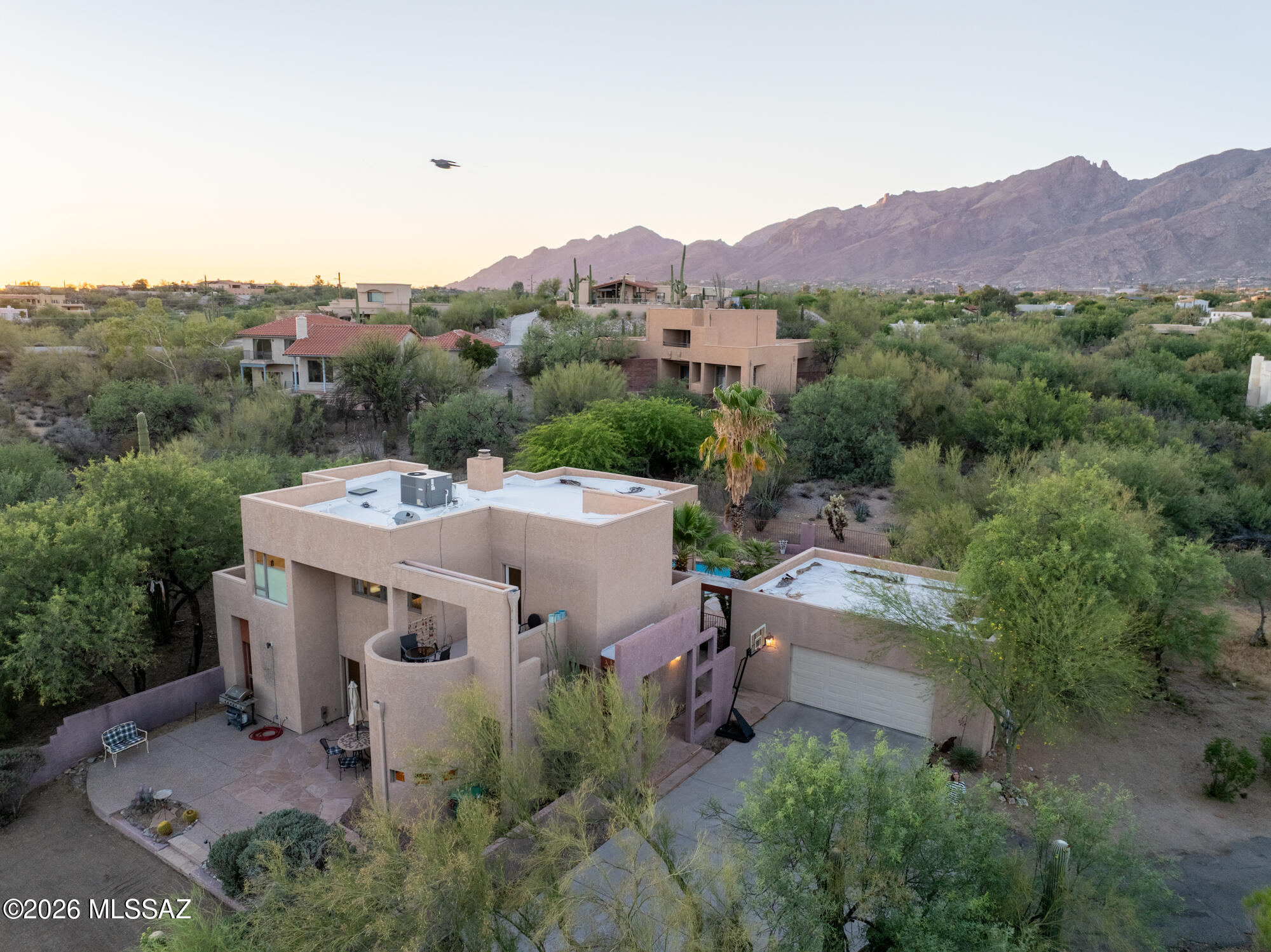 Tucked away in the prestigious Tucson Foothills, this extraordinary property offers a rare blend of privacy, seclusion, and architectural character, all set against a breathtaking Sonoran Desert backdrop. Positioned on a secluded lot, with two outdoor living areas and yet remains just minutes from premier dining, shopping, and hiking trails. Thoughtfully designed with clean lines and expansive windows, the home seamlessly connects indoor and outdoor living while framing the ever-changing landscape.  Soaring ceilings and open living spaces create a sense of light and air and walls of glass capture dramatic mountain views.  Whether you're entertaining under the stars or enjoying a quiet morning coffee with the mountains as your backdrop, this home delivers!! Schedule your showing ASAP!