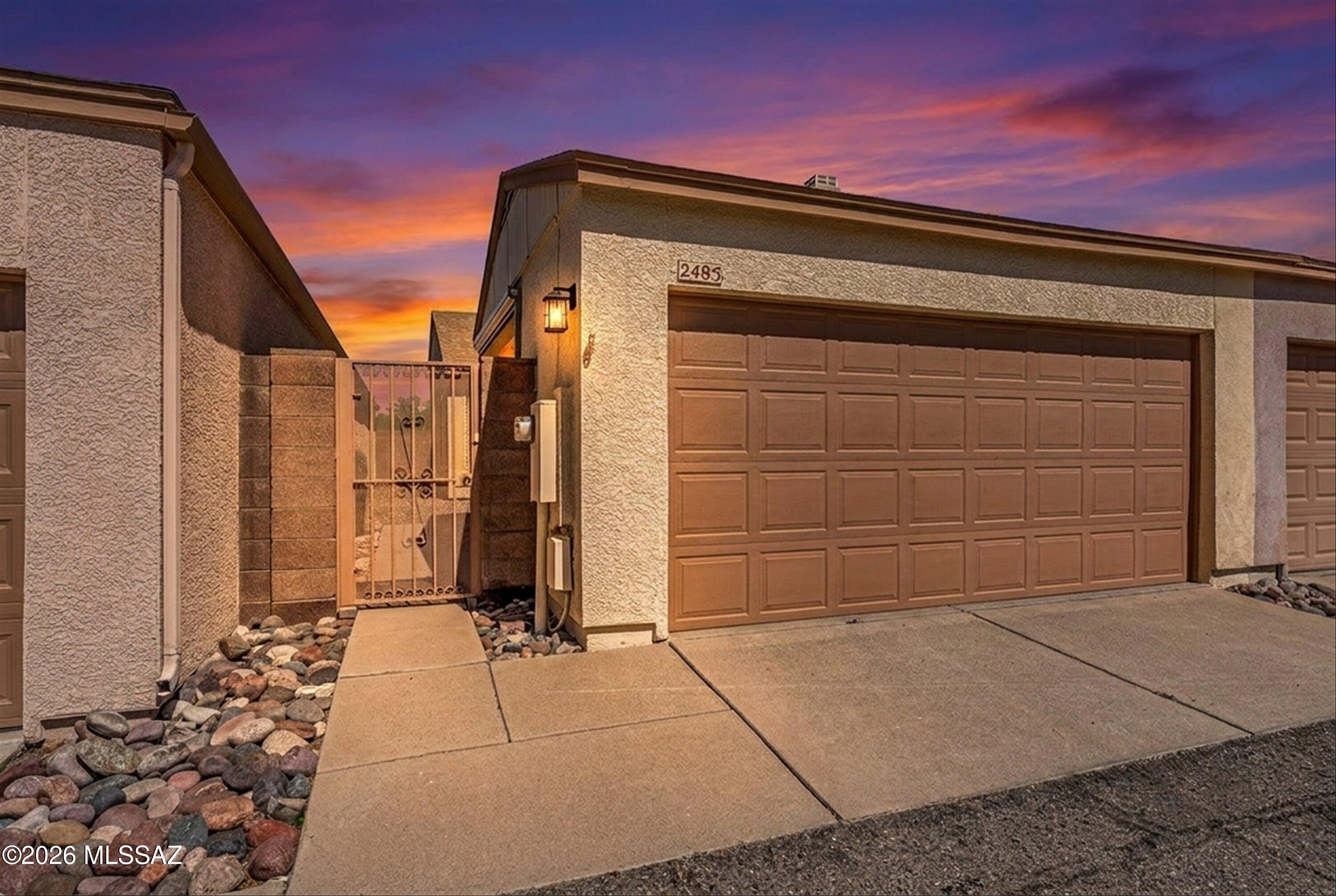 Nestled at the quiet end of a street in the highly coveted Casitas de Palo Santo community, this pristine 905-sqft Townhome offers a rare combination of sophisticated updates and genuine warmth. From the moment you arrive at this adorable gated enclave, you are greeted by a sense of security and a clear pride of ownership that carries through every corner of the property. Your journey begins in the spacious and private gated front courtyard, leading to a two-car garage that is uniquely equipped with dual Sunesta remote-controlled shades to keep your space dust and critter-free. Shimmering new Low-E windows hint at the home's excellent energy efficiency even before you step through the front door. Once inside, the Great Room feels incredibly bright and airy thanks to its vaulted ceilings-- completely free of popcorn texture--and a fresh coat of crisp interior paint. The space is elevated by new high-quality vinyl plank flooring and custom lighting/fans that add a touch of industrial class to the cozy atmosphere. The heart of the home flows seamlessly into the dining area, which overlooks a kitchen boasting newly installed granite countertops, a new large dual sink, and an abundance of solid wood cabinetry. To ensure total peace of mind, the home features newer appliances throughout, including a laundry room with a newer washer and dryer and a large closet that easily doubles as a pantry. Access the courtyard/ garage via its side door.
The primary wing is a true standout, offering a rare amount of space that comfortably fits a King-sized bed with room left over for a desk or reading nook. A new sliding door opens to your own private side patio, the perfect vantage point for taking in the Tucson Mountains and those legendary desert sunsets. This suite is rounded out by two spacious closets and an ensuite bath with a walk-in shower and newer fixtures. Because the home backs to open space, you never have to worry about a crowded feeling. Every mechanical detail has been meticulously addressed, including a new shingle roof installed in July 2021 with an 8-year guarantee, a flat roof recoated in August 2025 with a 2-year warranty, and a full Replumb with CPVC in November 2009. Further updates include a new HVAC system from 2018 with a 10-year warranty, a 2024 water heater, and a fresh termite treatment from June 2024.
Living here means having the best of the West side right at your fingertips, from hiking at Tumamoc Hill and Gates Pass to easy biking trails and quick access to Starr Pass and Del Rio Golf Course. Supermarket, services and dining options just about a block away. You are perfectly positioned near St. Mary's Hospital,Post office, Caterpillar, PCC West, and the I-10. The vibrant scene at the Mercado District and Downtown Tucson just a short trip away. With the University of Arizona, Raytheon, DMAFB, and the airport all within a 25-min or less commute, this home truly checks every box for both lifestyle and convenience.
Long-term rentals allowed. Check short-term rental terms with HOA.
Two of the sellers are licensed to sell Real Estate in the state of Arizona.