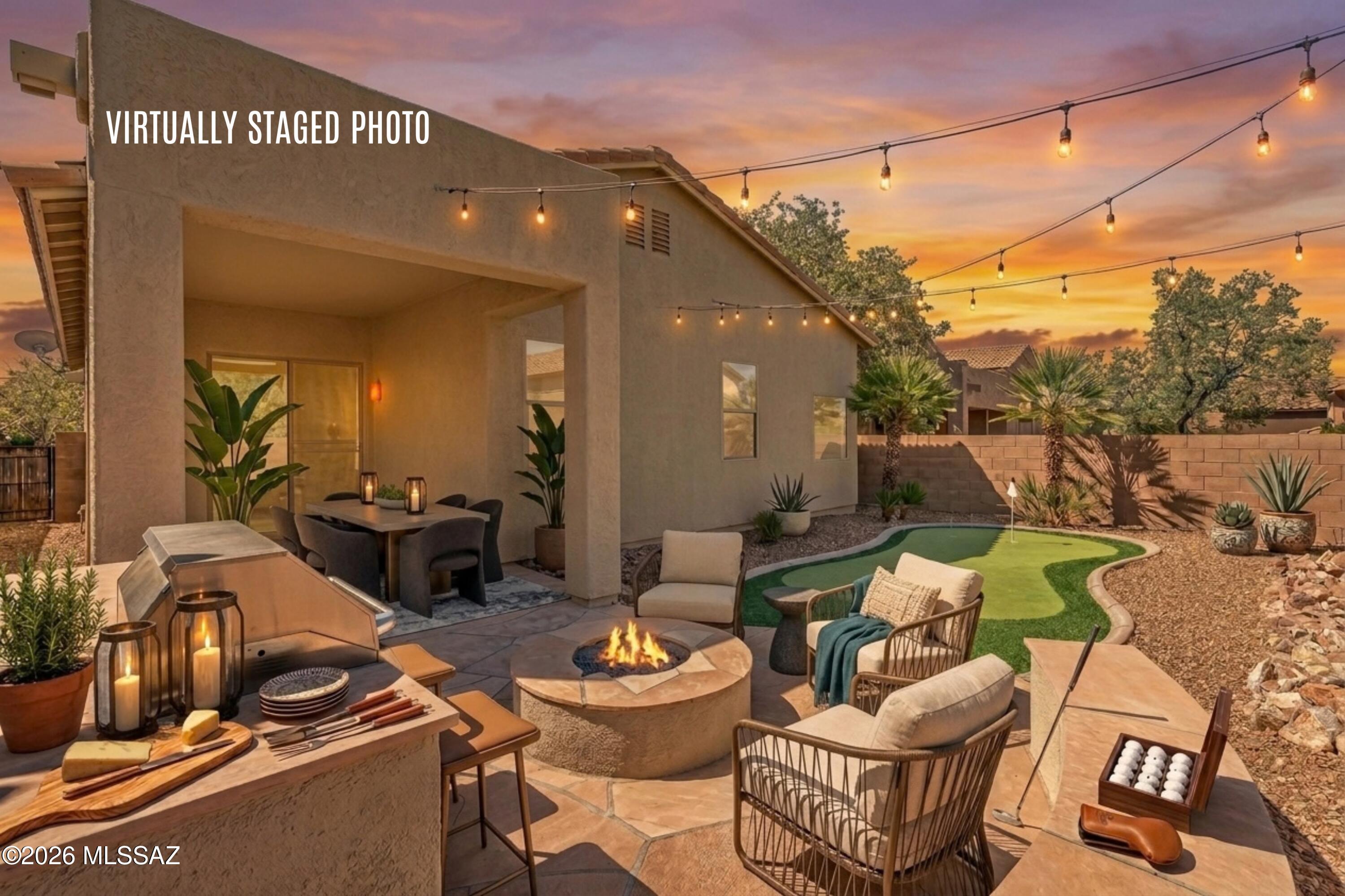 Backyard living, done right -- this refreshed 3-bed, 2-bath Rancho Del Lago home sits on a quiet cul-de-sac. The backyard is the showpiece: covered patio, built-in BBQ, fire pit with banco seating, synthetic putting green, and flagstone hardscape -- all framed by a privacy block wall and low-maintenance desert landscaping. Inside, a large flexible space that opens to a family room off the kitchen with gas fireplace and sliding doors to the patio. Fresh interior/exterior paint, new carpet, brushed nickel hardware, new can lights, and refreshed landscaping make it truly move-in ready. Add community amenities including a pool, tennis, walking paths, and parks at Rancho Del Lago, plus the highly rated & sought after Vail Unified School District --and you have Arizona living at its best. Click Backyard & Outdoor Living:

Covered patio off the family room -- morning coffee or evening dinners. 

Built-in BBQ station + flagstone hardscape -- built for entertaining
Fire pit with banco seating -- made for cool desert evenings

Synthetic putting green -- practice anytime, zero upkeep

Privacy block wall and low-maintenance desert landscaping -- no pool to maintain.

Quiet cul-de-sac lot with desert views

Inside the Home:

Built 2007; single-level, no interior steps -- just under 1,800 sq ft. 

Flexible Space upon entry OR formal front living/dining room; family room off kitchen with built-in gas fireplace

Kitchen: granite counters, breakfast bar, pantry, stainless appliances (gas range, dishwasher, disposal, microwave, refrigerator)

Primary suite with walk-in closet, separate shower & tub
High ceilings, skylights, dual-pane windows, ceiling fans

Inside laundry; 2-car garage

Updates & Condition

Fresh interior & exterior paint
New carpet in bedrooms & living/dining
Can (recessed) lights replaced
Hardware updated to brushed nickel
New gravel & refreshed desert landscaping
Move-in ready

Community & Location:

Rancho Del Lago: Pool, spa, tennis courts, playgrounds, ramadas, parks, walking/biking paths, pet-friendly

Low HOA covering common-area & road maintenance

Vail Unified School District -- Ocotillo Ridge Elementary, Cienega High

Colossal Cave Mountain Park minutes away

Easy access from Mary Ann Cleveland / Colossal Cave Rd