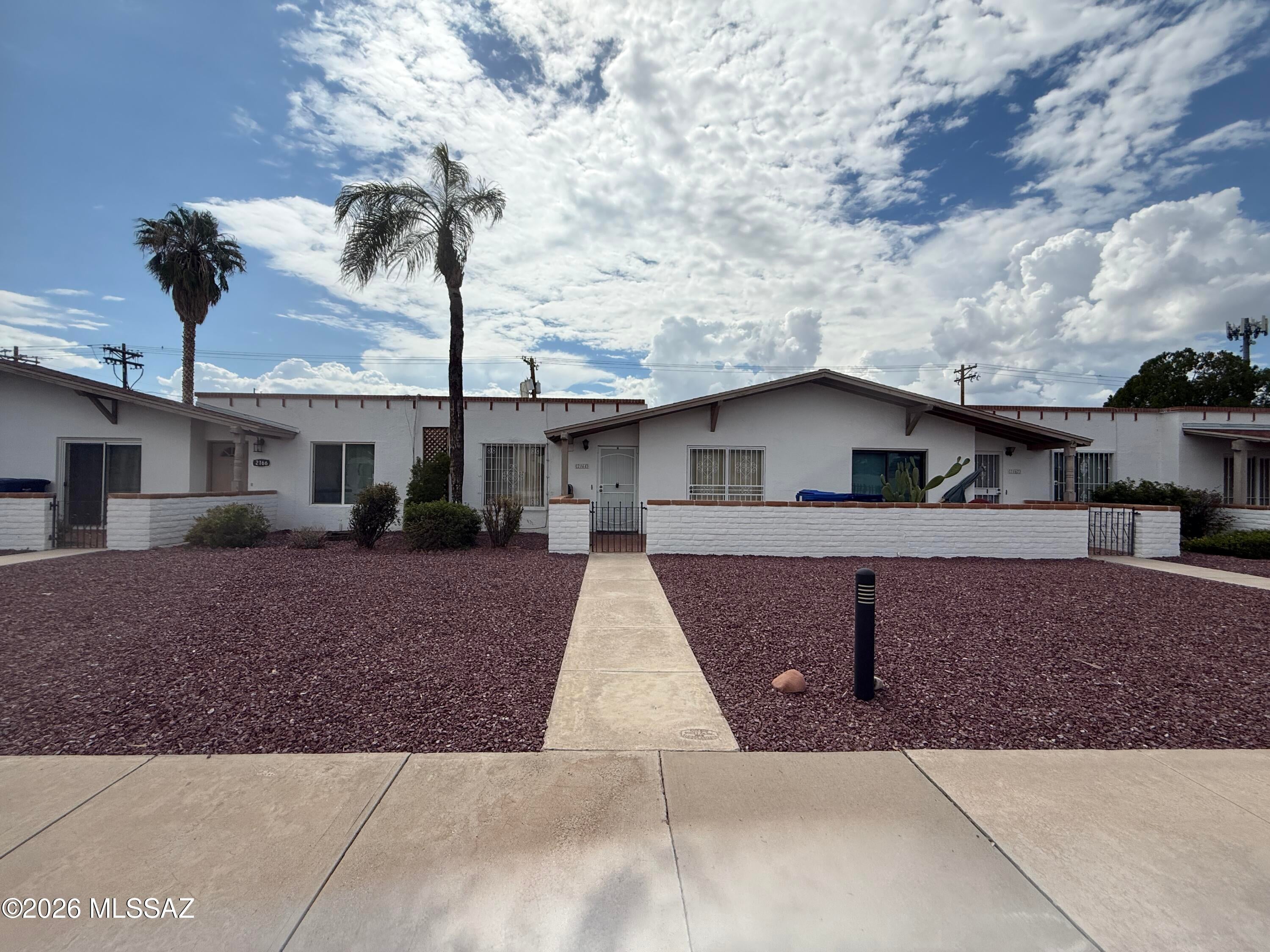 Wonderful opportunity to own this large, single level townhome with 2 spacious bedrooms and 2 full bathrooms, 2 car garage with extra storage room, updated kitchen with stainless steel appliances, walk-in pantry, skylights, recently refinished floors and community pool. Don't wait come see your new home today.