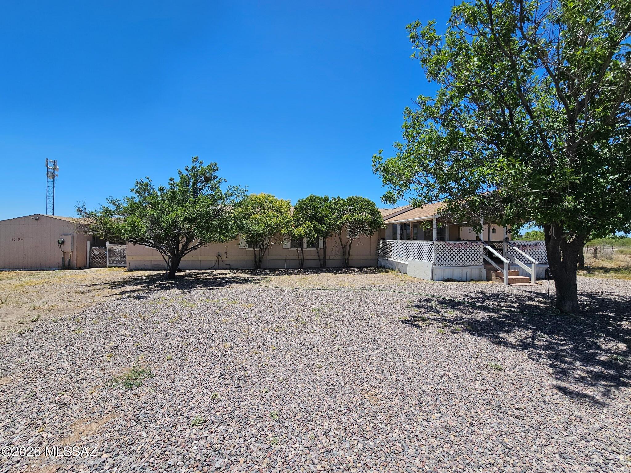 Spacious 4 bed/2 bath manufactured home offering 2,128 sq ft on 9.5 fenced acres with fabulous mountain views. Open living areas, family room, and a covered front porch perfect for enjoying quiet country living. Detached shop/barn on the property. Low-care landscaping with several mature trees. Easy year-round access off a paved road. Horses welcome - bring them home!
