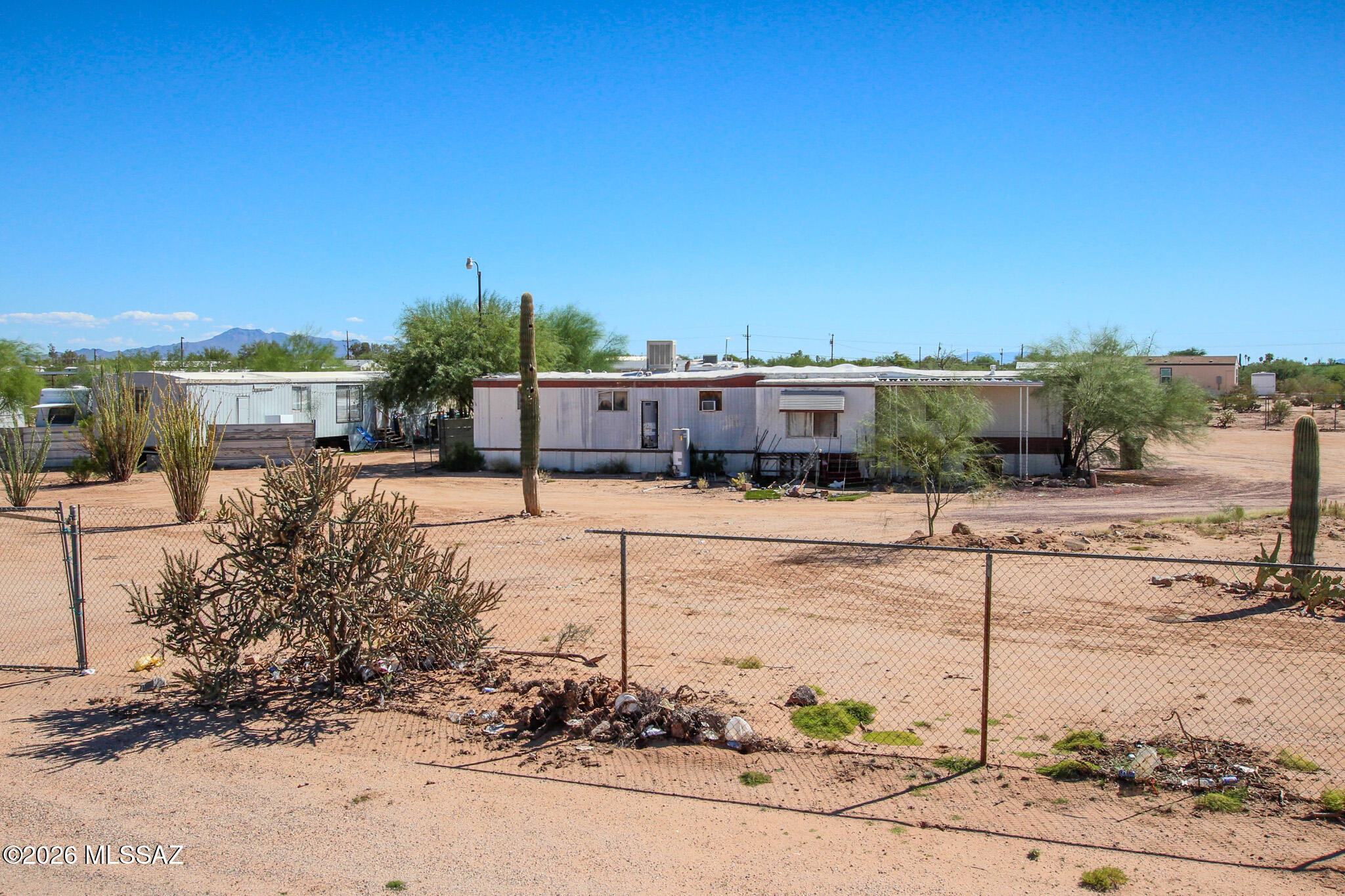 Prime 1.04-acre parcel located in Marana with utilities already on site. Zoned to allow horses, this spacious lot offers a fantastic opportunity to build a new custom home or place a new manufactured home. The property currently includes a trailer that will convey with the sale, providing immediate use or potential interim living while you plan your build. With generous acreage, existing utilities, and flexible use options, this property is ideal for buyers seeking space, rural charm, and future potential, all within the growing Marana area.