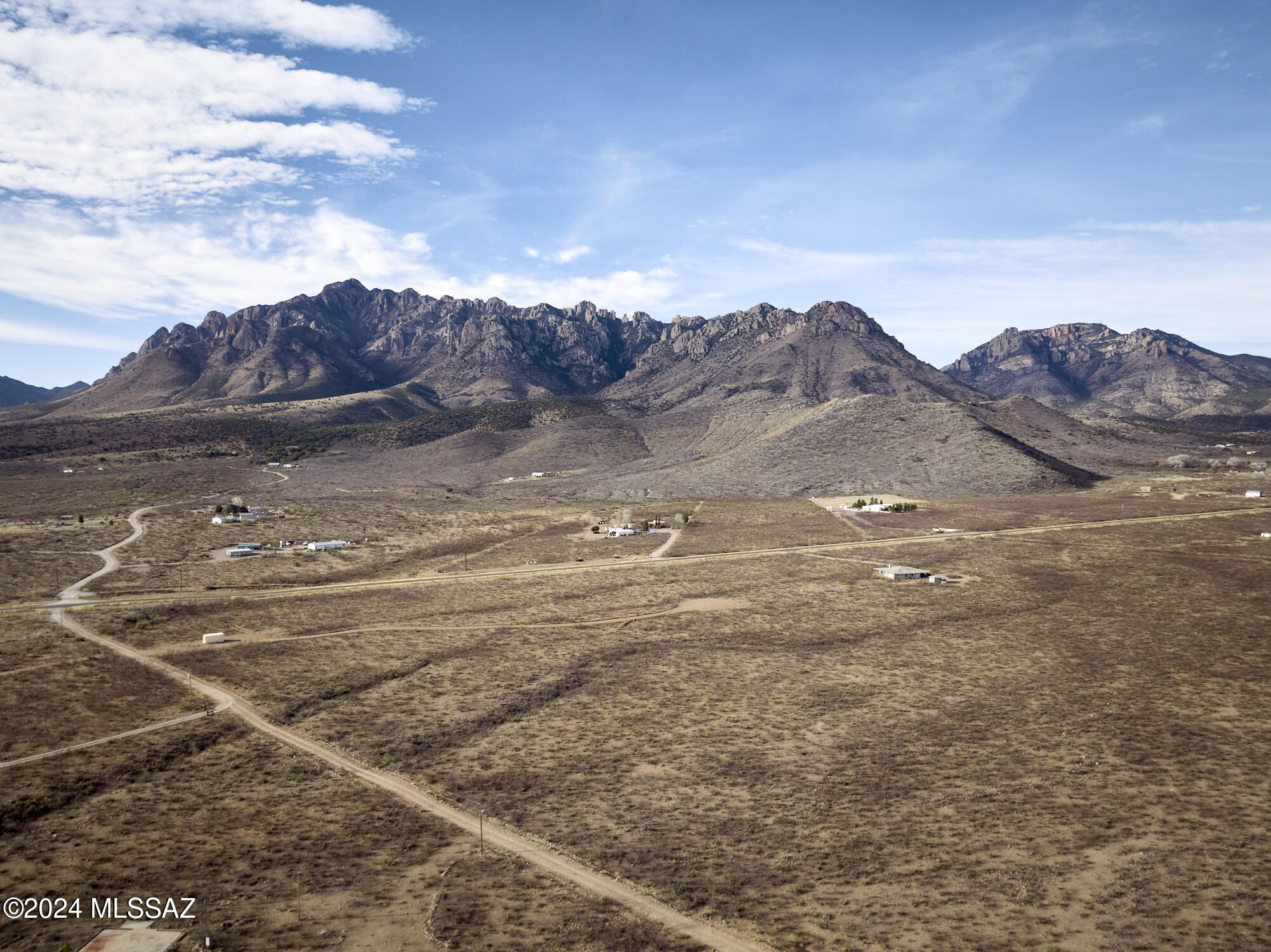 Enjoy epic mountain views of the Chiricahuas from 7+ acres in Portal, AZ - the Yosemite of Arizona!  Grid power on property line along Acacia Ln and at Portal Rd., 250' well with 10 GPM. Property features desert vegetation (mesquite and acacia). Zoned RU-4.  This is a great investment opportunity. 4 miles to Portal Peak Lodge & Cafe, 4 miles to birding and hiking in Cave Creek Canyon.  Portal is known for its abundant wildlife, dark night skies, hiking trails, and world class birding.