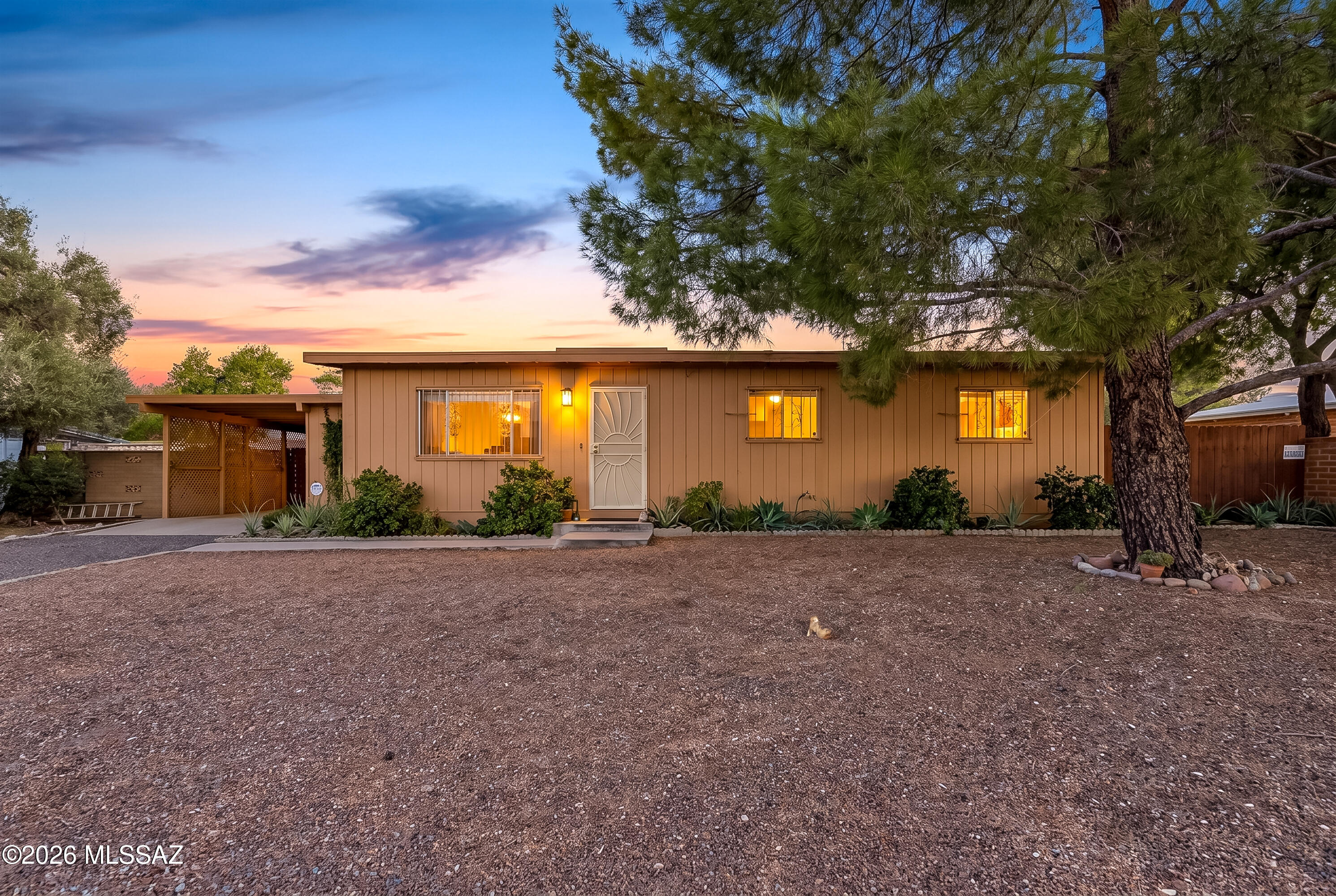 Welcome to this NO HOA, charming home featuring crown molding and recent updates like a 4-year-old water heater and a new cooktop. Tile flooring and neutral tones throughout. The living room boasts blinds and a ceiling fan, while the dining room offers a walk-in pantry. The cute galley kitchen has dual sinks, stainless steel appliances, Mexican tile countertops, and ample wood cabinets. The primary bath includes a walk-in shower and a single sink. Step outside to a serene haven with a private yard, four citrus trees, a covered patio for outdoor gatherings, and a useful storage shed. Plus, the property has leased solar for low energy bills. This lovely home invites you to call it your own.