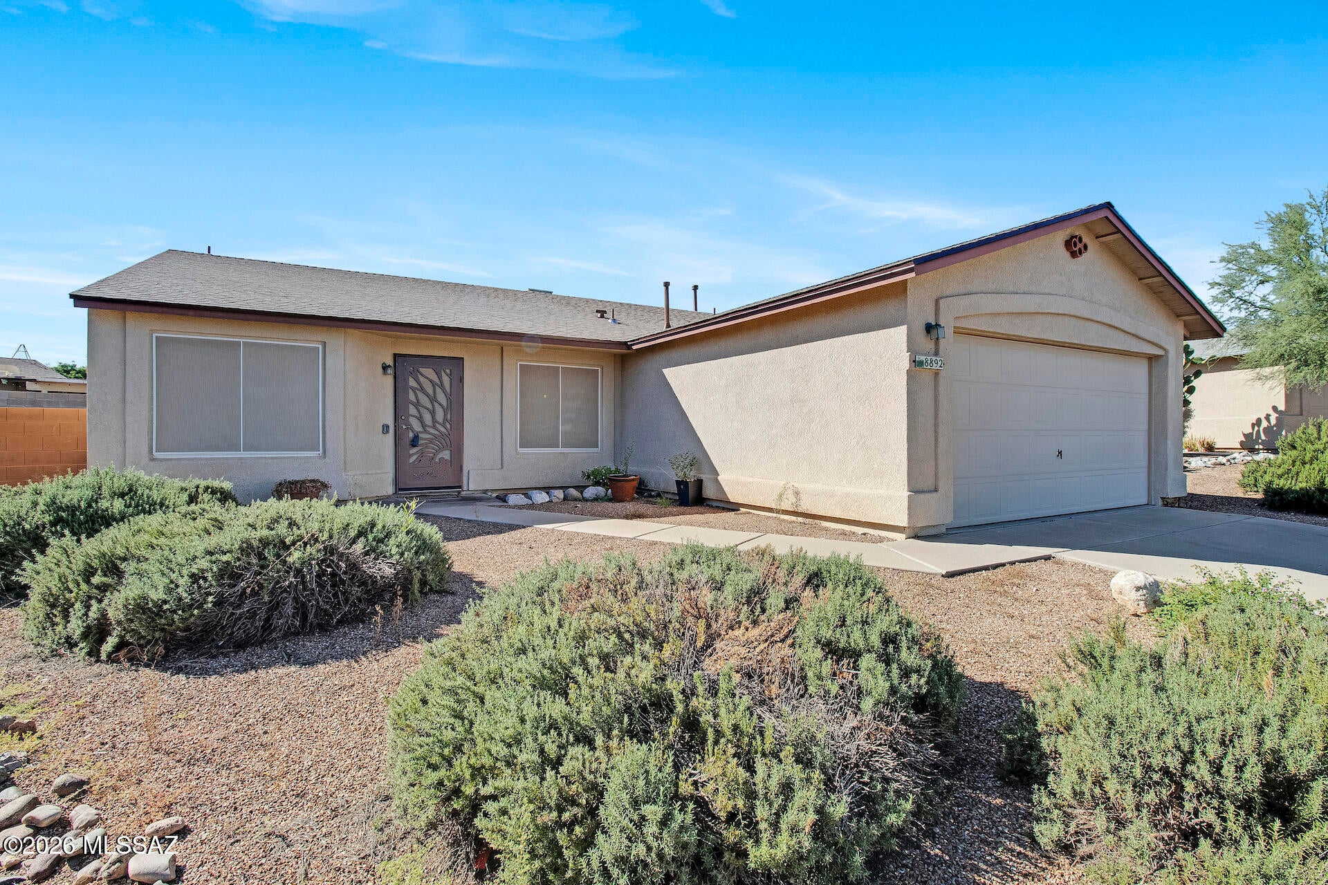 Brand-new roof, newer AC(2023) and water heater(2023): the big-ticket items are DONE! Tucked at the end of a quiet cul-de-sac on Tucson's east side, this single-story 3 bed, 2 bath home sits on a generous 0.21-acre lot with a 2-car garage. Inside, vaulted ceilings and wood-look flooring flow through an open kitchen, dining, and family room. The kitchen offers abundant counter space, a pantry, a breakfast bar, and a deep single-basin sink with a pro-style faucet. The spacious primary suite features dual mirrored closets and a walk-in shower, plus there's an updated guest bath. Step outside to a covered patio and a large block-fenced backyard with room to garden, play, or entertain. Low HOA and low-care desert landscaping. Minutes to Davis-Monthan AFB, Raytheon