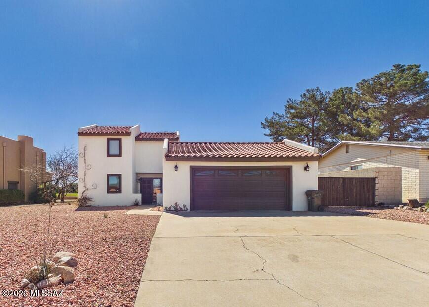 Welcome to 3414 Oak Hill Street, a charming golf course home with beautiful mountain views and classic Southwest comfort. From the moment you arrive, the inviting curb appeal and desert landscaping create a warm first impression.

Inside, the light filled living area centers around a cozy wood burning fireplace, creating a perfect space to relax or entertain. The kitchen features granite countertops, ample cabinetry, and a functional island that flows naturally into the dining and living spaces.

Upstairs, the spacious primary suite offers a private retreat with its own balcony, an ideal spot to enjoy morning coffee while taking in the mountain scenery. Two additional bedrooms provide flexibility for guests, family, or home office. Step outside to a peaceful backyard that backs to the golf course, where open skies and desert views create a tranquil setting. With thoughtful upgrades including a tankless water heater and EV charger, this well maintained home combines comfort, convenience, and scenic living in Sierra Vista.