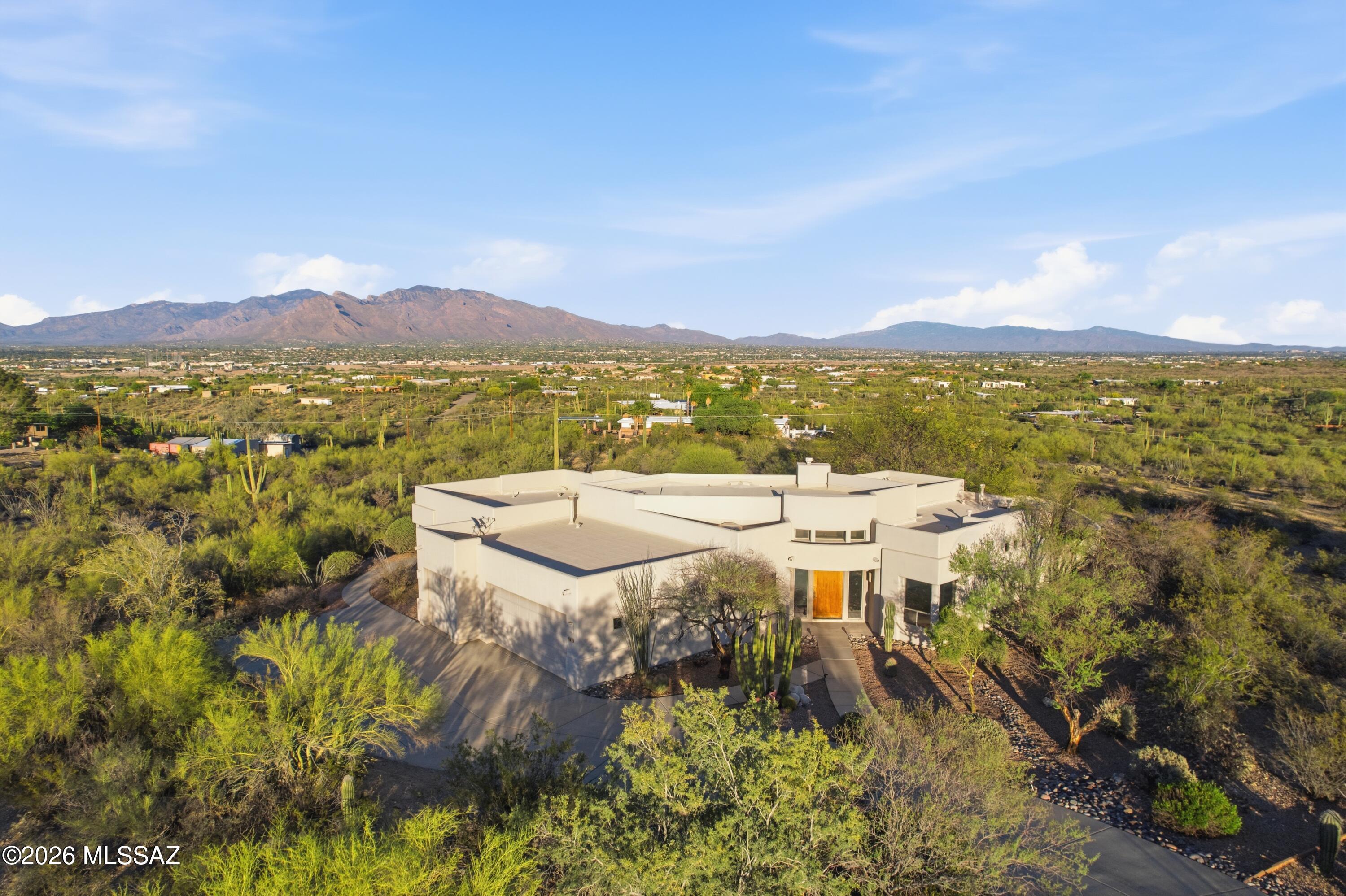 Stunning views and privacy await you at this semi custom home in the Tucson Preserve!! This single level split floor plan with lots of natural light just needs your cosmetic touch.
