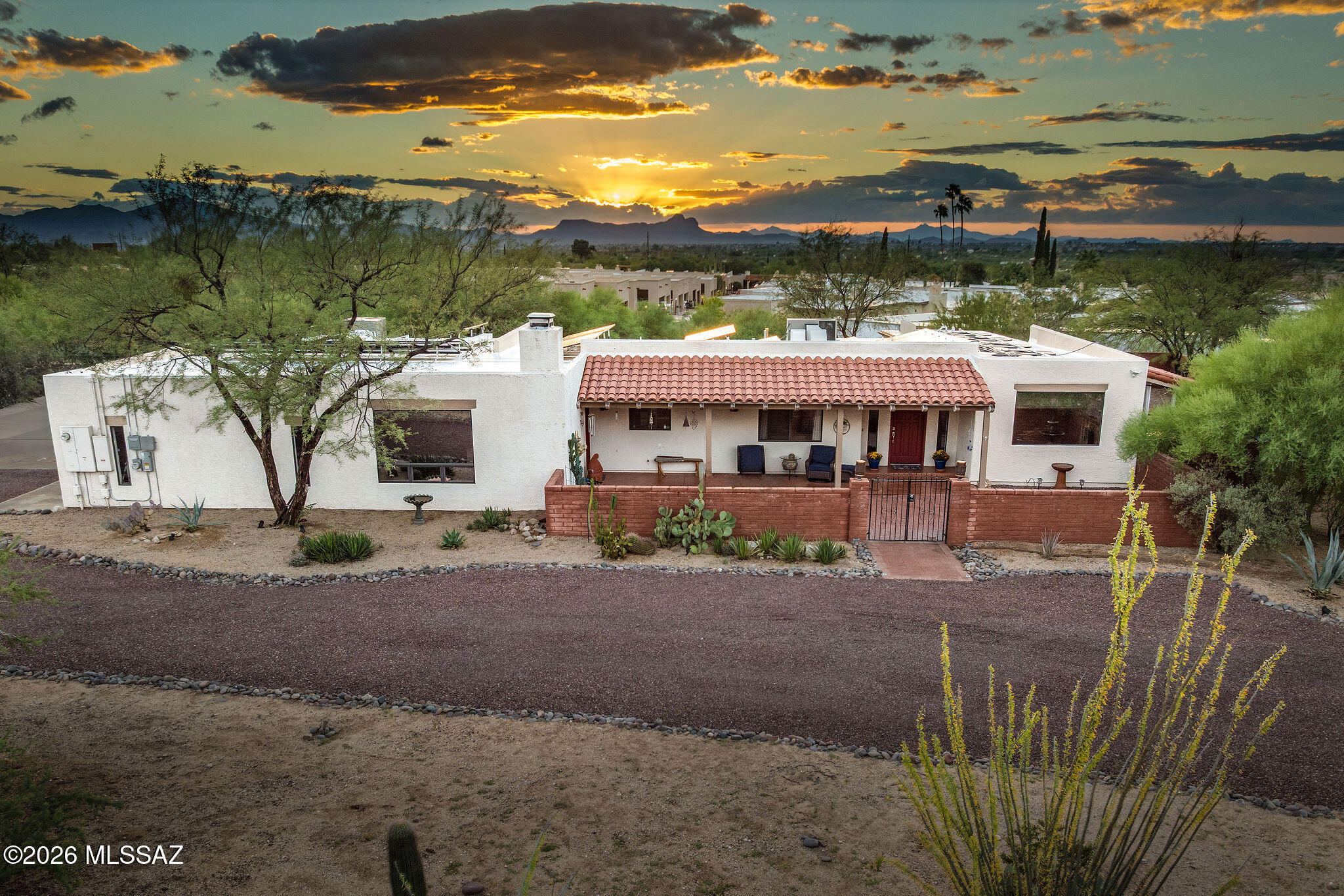Range price $995,000-$1,100,000. This beautiful home is situated on just under an acre lot, designed to take advantage of the breathtaking Pusch Ridge Mountain Views! Additionally, this property features a 1,069sf guest house with a bedroom, bathroom, living room and a kitchen that is fully equipped for any home! It's perfect for multigenerational living or rental income. No HOA in this desirable neighborhood and lots of room for your RV or toys! 
The charming curb appeal features a circular driveway and a large stunning courtyard that is the perfect place to enjoy the sunrise or relax and enjoy the gorgeous mountain views! 
Inside you have a wonderful floor plan and multiple picturesque views of Pusch Ridge Mountain. Updated bathrooms & kitchen! The living room leads you to the backyard and the covered patio overlooking the solar heated pool.

The updated kitchen features quartz countertops, custom tiled backsplash (from counter to cabinet!), beautifully painted cabinetry with new stainless steel hardware; Kitchenaid stainless steel appliances with a built-in oven and microwave, a 36-inch induction cooktop and a custom Thermador vented hood accented with a decorative Herringbone laid tile design. The bar seating and the breakfast nook connect you to the family room with a wood burning fireplace and access to the courtyard. 

You have generously sized bedrooms and an updated hall bath with gorgeous painted cabinetry with a new quartz countertop and undermount sink, stainless steel hardware, decorative mirror and a door to access to the backyard. 

Your primary bedroom offers a walk-in closet plus a second closet the size of a bedroom-a dream space for anyone! Plus, a bonus space with a built in desk that can also be used as a sitting area or work out space. Bathroom has been updated with newly painted cabinetry, stainless hardware, and gorgeous quartz countertop with undermount dual sinks. Enjoy the soaking tub plus the separate walk in shower with tile surround.

The oversized garage features custom storage cabinets, plenty of space for a workshop, epoxy floors and freshly painted interior!  Plenty of parking with the circular driveway and concrete pads outside of the garage AND next to the Guest House entrance. Newly painted storage shed is conveniently near the garage. 

Owned and paid for Solar will save you so much money! The solar heated pool allows for longer swimming enjoyment throughout the year. 

The guest house is attached to the main home by a flexible 10'x8' room with a closet for storage and would make a great space for a library, a bar area or mud room entry leading to the guest house. You also have a separate entrance into the GH kitchen for added privacy. Lots of natural light, kitchen has decorative glass cabinets doors, granite countertops, and dining space - very comfortable with a large bedroom, updated bathroom with an oversized walk-in shower, newer vanity, lighting and mirror. Features French doors that lead to the porch, huge laundry room that is plumbed for a sink and tons of storage plus electronic shutters on door and windows. 

This lot has additional backyard space fully enclosed with a block wall and can also be accessed through the alley. Enjoy the newly installed 10' rolling metal gate for access.

You are close to shopping, dining, and multiple trailheads nearby for the outdoor enthusiast! Call for your private tour.