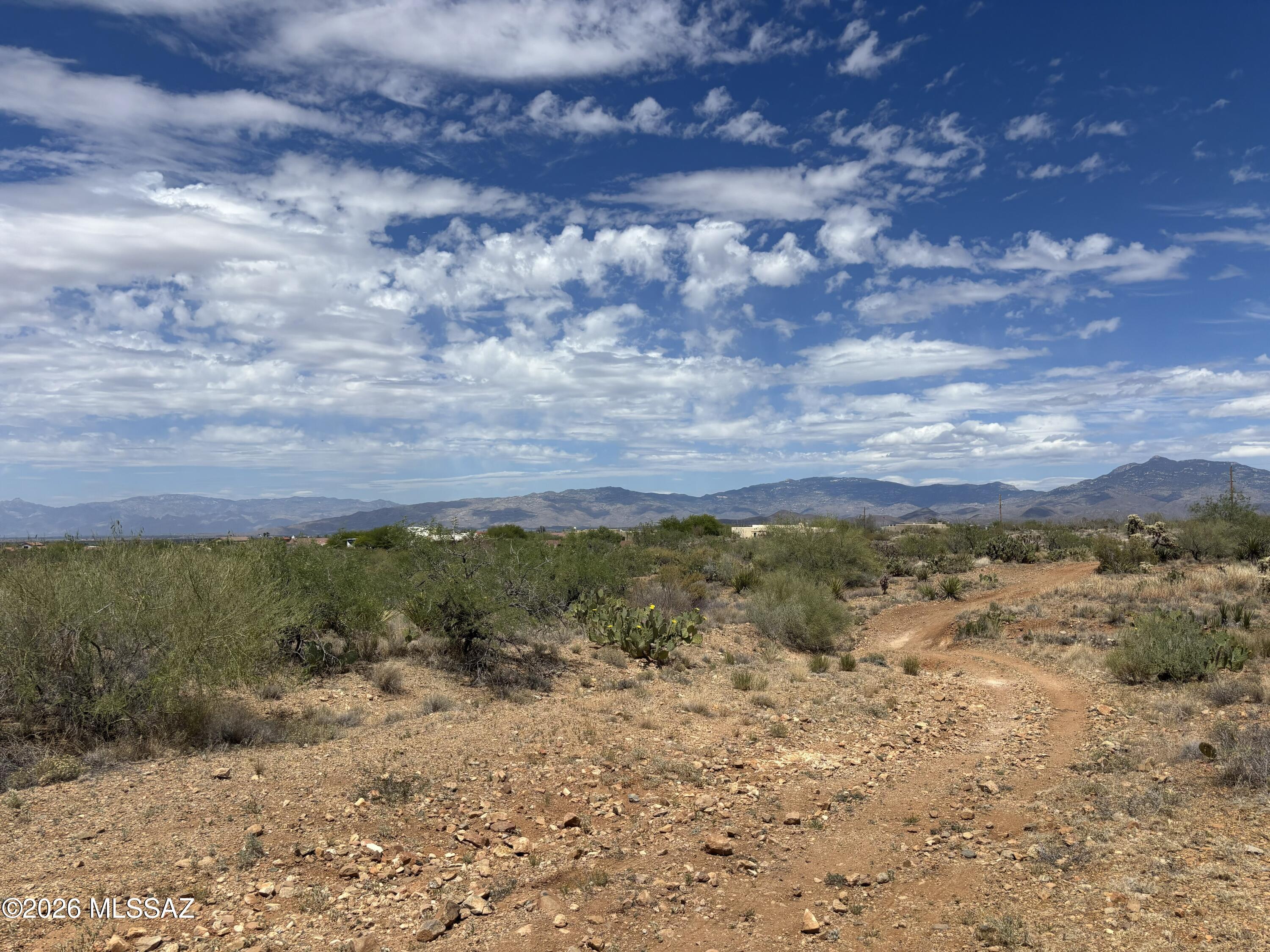 Bare land no improvements.  The property is perfect for someone who likes living in the country but close to stores.  There is a lot of growth in the area.  It is also zoned for horses.  There are homes nearby and utilities in the area just not at the lot line or near the lot.