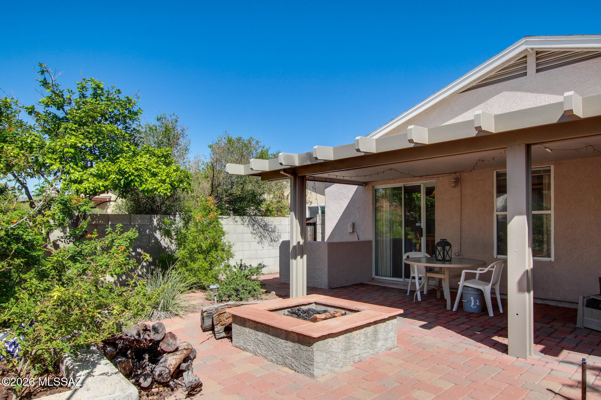 From the moment you arrive, this home feels exceptionally well cared for and almost brand new. The inviting interior features wood-look flooring throughout the living room and kitchen, with newer carpet in the master bedroom. The spacious laundry room provides added convenience and leads directly to the 2-car garage.

Recent improvements include a new roof with leased Tesla solar, a new front sewer line, and a reverse osmosis system at the kitchen sink and refrigerator. Step outside to enjoy an extended covered patio and a brick-paver patio perfect for entertaining, relaxing, or enjoying evenings around the firepit. The front and back yards feature an automatic drip irrigation system with a programmable timer, making landscaping easy to maintain.