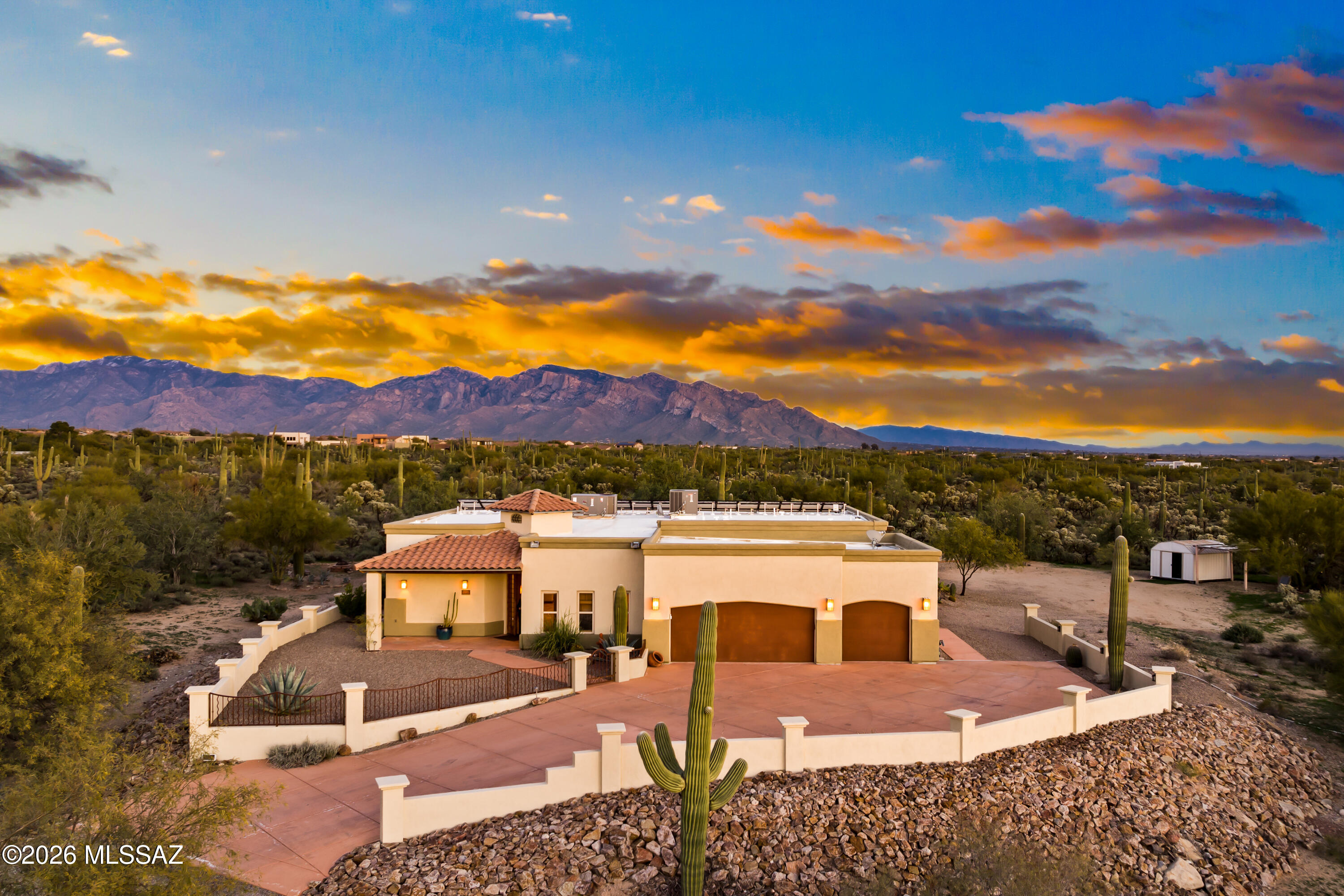 An elegant Southwest estate offering a split-bedroom, open-concept floor plan with 4 bedrooms, 3.5 bathrooms, and 3,293 SqFt of living space. Set on an elevated 3.31 acres of pristine desert, the property delivers exceptional privacy, no HOA, and breathtaking 360° Catalina Mountain and desert views. Architectural highlights include barrel-rolled ceilings, solid knotty alder doors, and quality finishes throughout. Recent upgrades include a new HVAC system, exterior repaint, and roof re-coating. A fully paid Tesla solar system and private water well provide impressive efficiency and low utility costs. Outdoor living features a covered pergola with built-in grill. Zoned SR with room for RVs, horses, casita, or expansion. Schedule your private tour and experience elevated desert living!