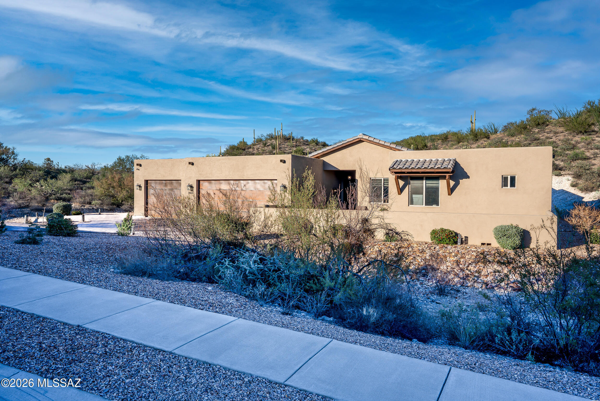 Life within the gates at Star Pass is one of luxury, peace & natural beauty. Custom built in 2023 on over an acre of gorgeous desert landscape, your new 4 bed, 3 bath masterpiece is a prime example of modern, sophisticated elegance. 
As you enter the grand room after a round of golf at the world class resort steps from your door, lounge in the sleek, open floor plan. Plan meals to remember in your chef's kitchen with its dreamy walk-in pantry before retiring to the media room to watch the game. 
Energy star certified & smart-home equipped, the high ceilings make acoustics on point with a cutting edge, individually controlled sound system. A generous 3 car garage highlights a lifestyle of amenities & abundance. Take splendor with pools, spas, golf, hiking trails & resort time at your whim
