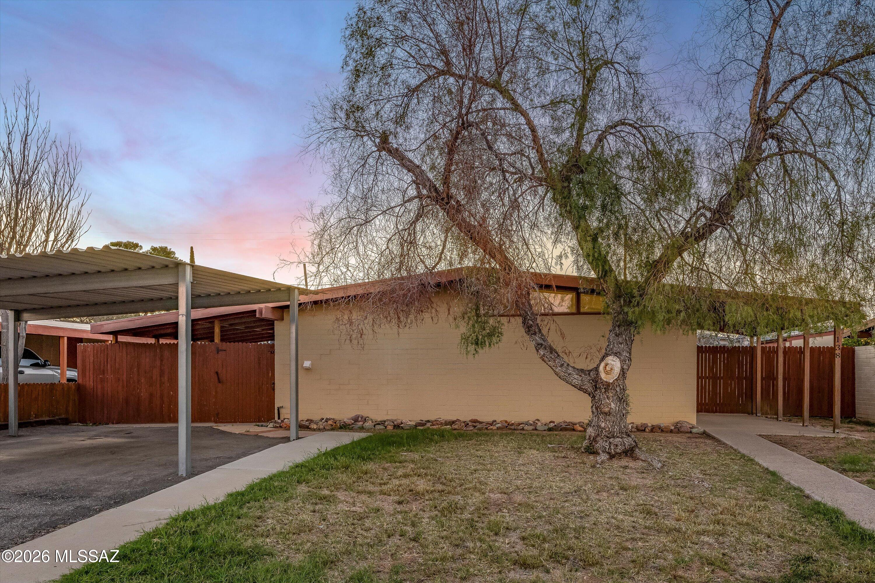 This charming 2-bedroom, 1-bath home with modern updates is completely move-in ready. Recent improvements include an expanded kitchen featuring new cabinets, countertops, and appliances, a modernized bathroom, newer AC and furnace, dual-pane windows, and stylish ceramic tile and laminate flooring throughout. The updated bathroom offers a tiled shower, along with a modern toilet and vanity. A washer and dryer are included, adding extra convenience for the new owner. Outside, you'll find a spacious backyard with additional covered porch areas and extra storage, perfect for relaxing or entertaining. The front yard offers stunning views, along with a paved asphalt driveway with a large two car carport for easy parking. Conveniently located near the newly improved Pinal County Park, the post office, and local shops, this home combines comfort, updates, and a great location.Schedule your showing today and start enjoying this wonderful home!