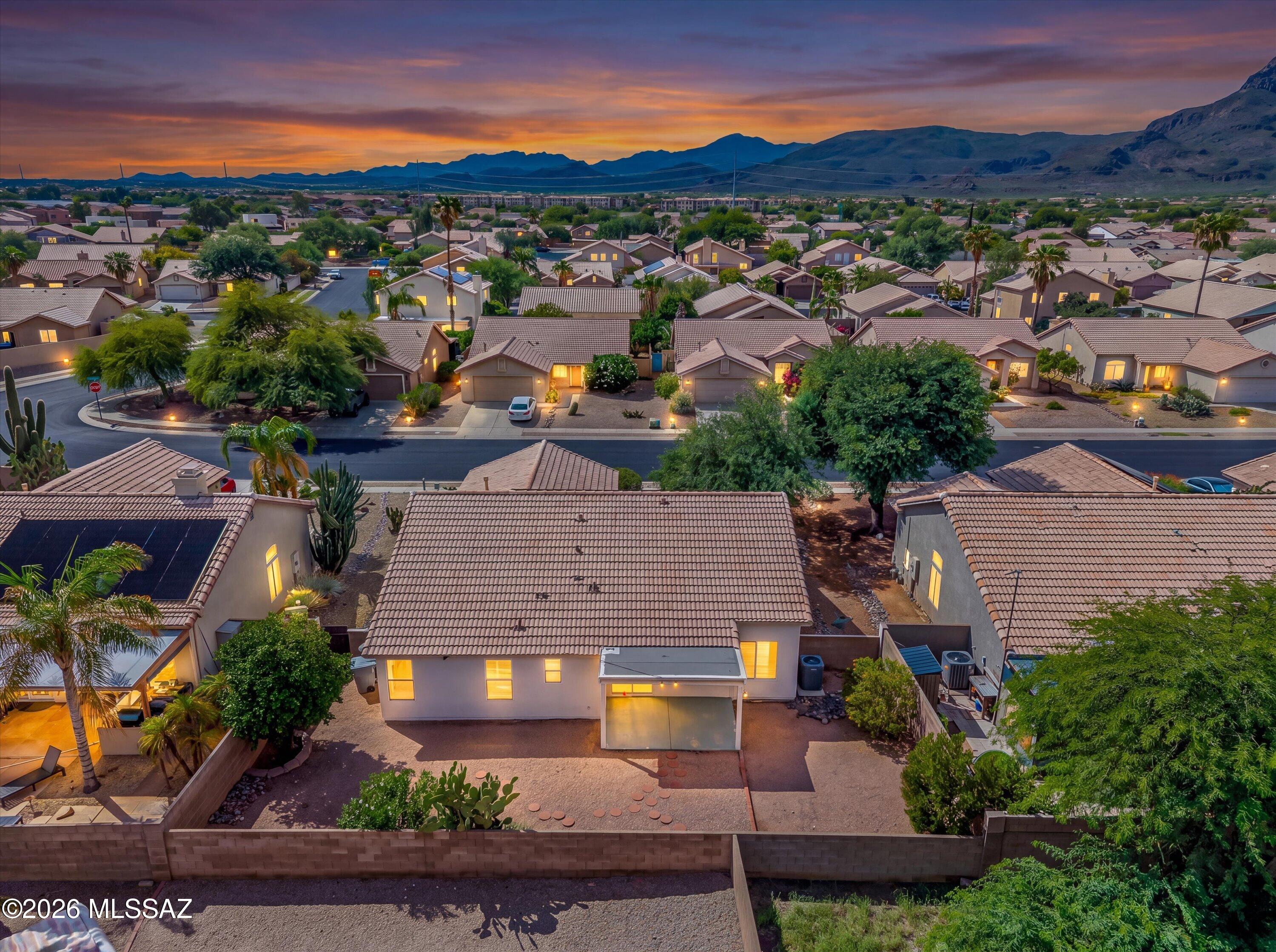 Welcome to easy Arizona living in the heart of Continental Ranch! This beautifully maintained 3-bedroom, 2-bath home with a versatile den offers 1,578 sq. ft. of inviting living space in one of Marana's most desirable communities. Step inside to discover a bright, open floor plan enhanced by soaring vaulted ceilings, warm laminate wood flooring, and abundant natural light. The spacious great room creates the perfect setting for relaxing at home, entertaining friends, or gathering with family. The kitchen is both stylish and functional, featuring granite countertops, generous cabinetry, and newer stainless-steel appliances, including the refrigerator, dishwasher, and microwave. With its open connection to the main living area, the kitchen allows the cook to remain part of every conversation In addition to three comfortable bedrooms, the home includes a separate den that can easily serve as a home office, media room, playroom, fitness space, or guest retreat. The flexible layout provides room to adapt as your needs change. Major updates offer added comfort and peace of mind, with both the HVAC system and water heater replaced in the last few years. A newer garage door opener adds everyday convenience, while owned solar provides valuable energy efficiency and the potential for significant utility savings. Beyond the home, Continental Ranch offers an exceptional community lifestyle with a swimming pool, relaxing spa, scenic walking paths, tennis courts, basketball courts, and a welcoming clubhouse. Whether you enjoy an active lifestyle or simply want a neighborhood with abundant amenities, this community has something for everyone. The location is equally impressive, with convenient freeway access, award-winning schools, popular restaurants, shopping, and the Tucson Premium Outlets all just moments away. Enjoy the perfect combination of comfort, energy efficiency, thoughtful updates, and access to everything Marana has to offer. This is more than a home, it is an opportunity to enjoy the relaxed, connected, and convenient Continental Ranch lifestyle!