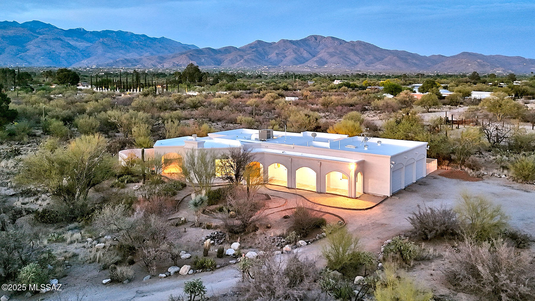 Stunning Rancho del Jefe Home with Guest House, Mountain Views & set on a private, gated 3.2-acre lot in the desirable Rancho del Jefe community, this beautiful 3 bed, 4 bath Southwestern-style home offers breathtaking views of the Rincon and Catalina Mountains. Built in 1984, the 2,927 sq. ft. main residence has been thoughtfully upgraded with a one brand-newly coated roof, fresh interior and exterior paint, and new picture windows that frame the surrounding desert landscape. Interior highlights include colored concrete floors, high ceilings, a striking rock fireplace, formal dining room, and a spacious family room perfect for both everyday living and entertaining. A separate,  638 sq. ft. guest house offers privacy and flexibility, complete with its own ensuite bathroom, private yard, and separate entrance ideal for guests, extended family, or a studio/home office. The home also features a 980 sq. ft. 3-car garage, a walled backyard with brick pavers, a covered patio, and plenty of space to enjoy the expansive desert vistas. Horse property potential adds to the appeal. Don't miss this unique opportunity to own a peaceful desert retreat with modern updates, panoramic mountain views, and the charm of true Southwestern living.