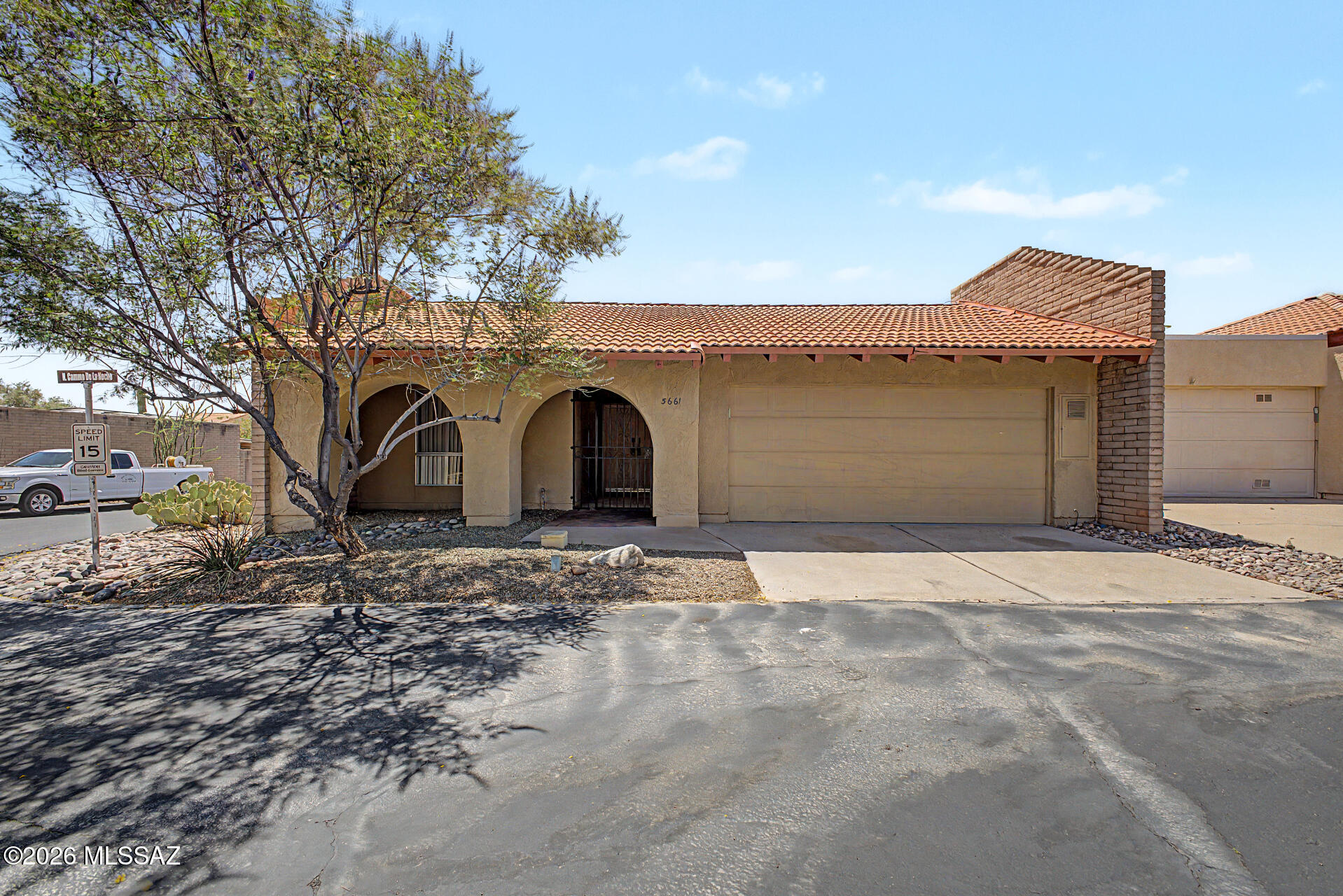Be welcomed to this 2-bedroom home on a desirable corner lot! You'll love the attractive desert landscaping & gated entrance. Thoughtfully designed interior filled with abundant natural light, neutral paint, skylights, & tile flooring throughout. Enjoy spacious living and dining rooms, along with a bright family room. The kitchen has wood cabinetry, granite counters, built-in appliances, a mosaic backsplash, & breakfast bar ideal for casual dining. The serene primary suite provides direct backyard access, a walk-in closet, & a private bathroom boasting dual sinks. Outside, a paved patio overlooks the sparkling fenced blue pool for outdoor dining, entertaining, or simply enjoying sunny Arizona days. Community amenities are a gym, lighted tennis courts, playground, clubhouse, etc. Stop by! - Converted a large atrium into a dining room, adding 100 square feet of living space.
  - Converted a small atrium in the master bathroom to additional storage space.
  - Installed all new kitchen cabinets, doubling storage capacity.
  - Repainted the entire interior.
  - Installed two skylights.
  - Installed several can lights in the living room, kitchen, and hallway.
  - Installed three new ceiling fans and light fixtures in the dining room, living room, and master bedroom.
  - Added a natural gas line from the street into the home.
  - Installed a high-end backsplash and granite throughout the kitchen.
  - Installed enhanced lighting fixtures over the kitchen granite nook.
  - Upgraded the kitchen window from single-pane to double-pane.
  - Installed new appliances, including a new hood over the oven.
  - Installed a new gas heating and cooling system package unit.
  - Installed a new gas hot water heater and a gas line for the dryer in the garage.
  - Cleaned the ductwork throughout the home.
  - Re-plastered the swimming pool, cleaned the pool tiles, and repainted the pool deck.

The HOA provides for trash pickup, front yard landscaping, and internet, in addition to community swimming pool, clubhouse, and gym access.