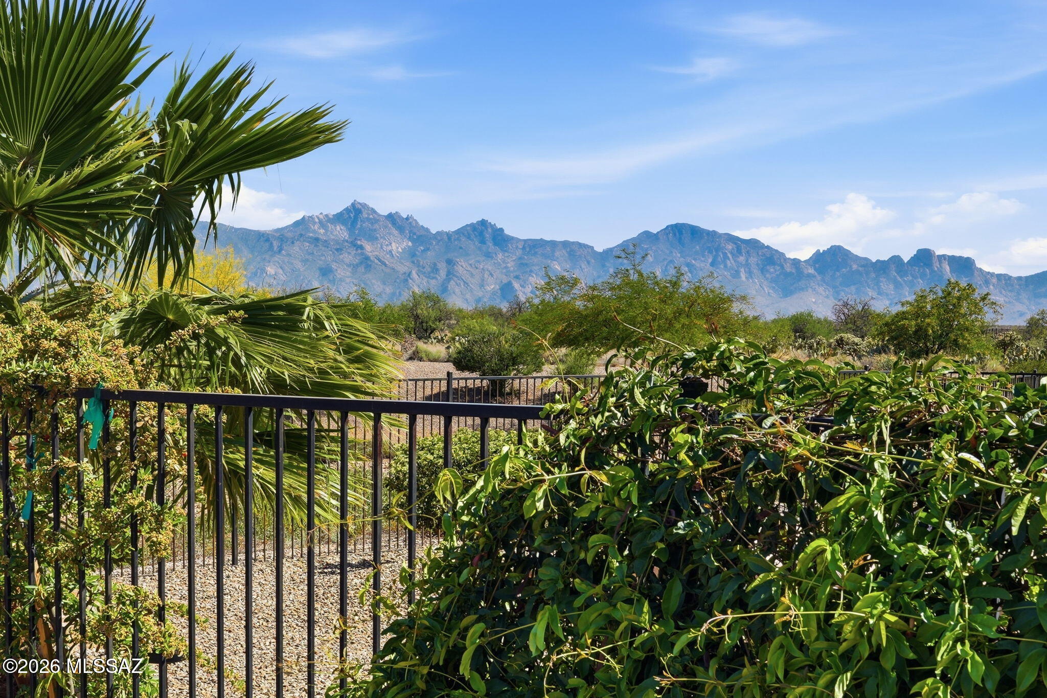 Located in the highly desirable SaddleBrooke Ranch community in Oracle, this beautifully maintained 2015 Dolce model offers mountain views and energy-efficient living with owned solar.
The home features 2 bedrooms, a den, and 2.5 bathrooms across 1,769 sq ft, plus a 2-car garage. A custom tiled inlay foyer welcomes you into a bright open floor plan filled with natural light. The kitchen includes stainless steel appliances, quartz countertops with tile backsplash, and 42'' nutmeg cabinets, along with custom lighting and ceiling fans throughout. The spacious owner's suite features an updated bathroom and walk-in closet, while the guest bedroom includes an ensuite bath. Large sliding doors open to a covered paver patio with beautiful mountain views, creating the perfect place to relax & enjo
