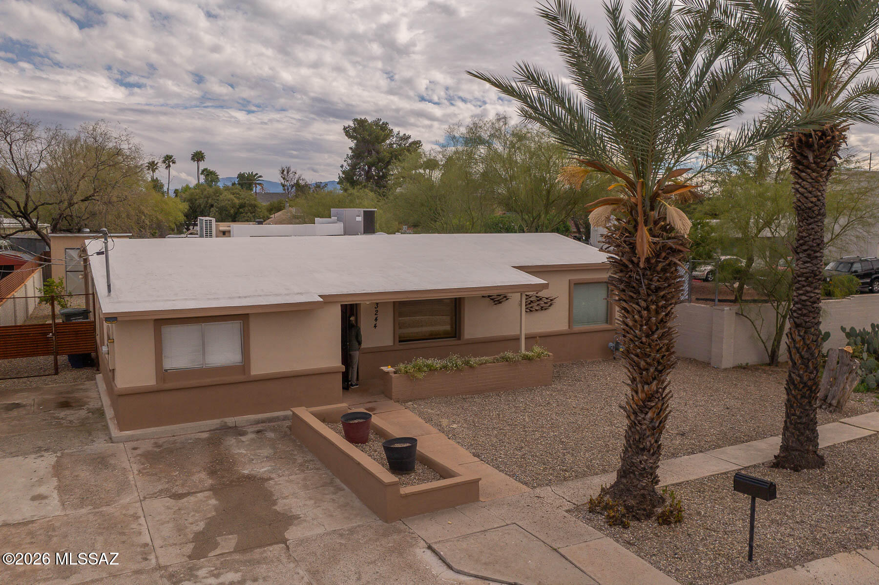 Welcome to this charming well cared for 4-bedroom, 2-bath home set on a spacious lot in a central location. No HOA. Enjoy convenient access to UofA, Banner Hospital, the Riverwalk, shopping, parks and all the best Tucson has to offer. Open living area is bright and inviting, highlighted by a cozy Cantera stone fireplace. Ideal for gatherings or quiet evenings.  Easy maintenance with tile flooring throughout, and modern updates. Large fully walled and low maintenance backyard is perfect for entertaining or additional storage. End of cul-de-sac location is quiet with plenty of off street parking and privacy.