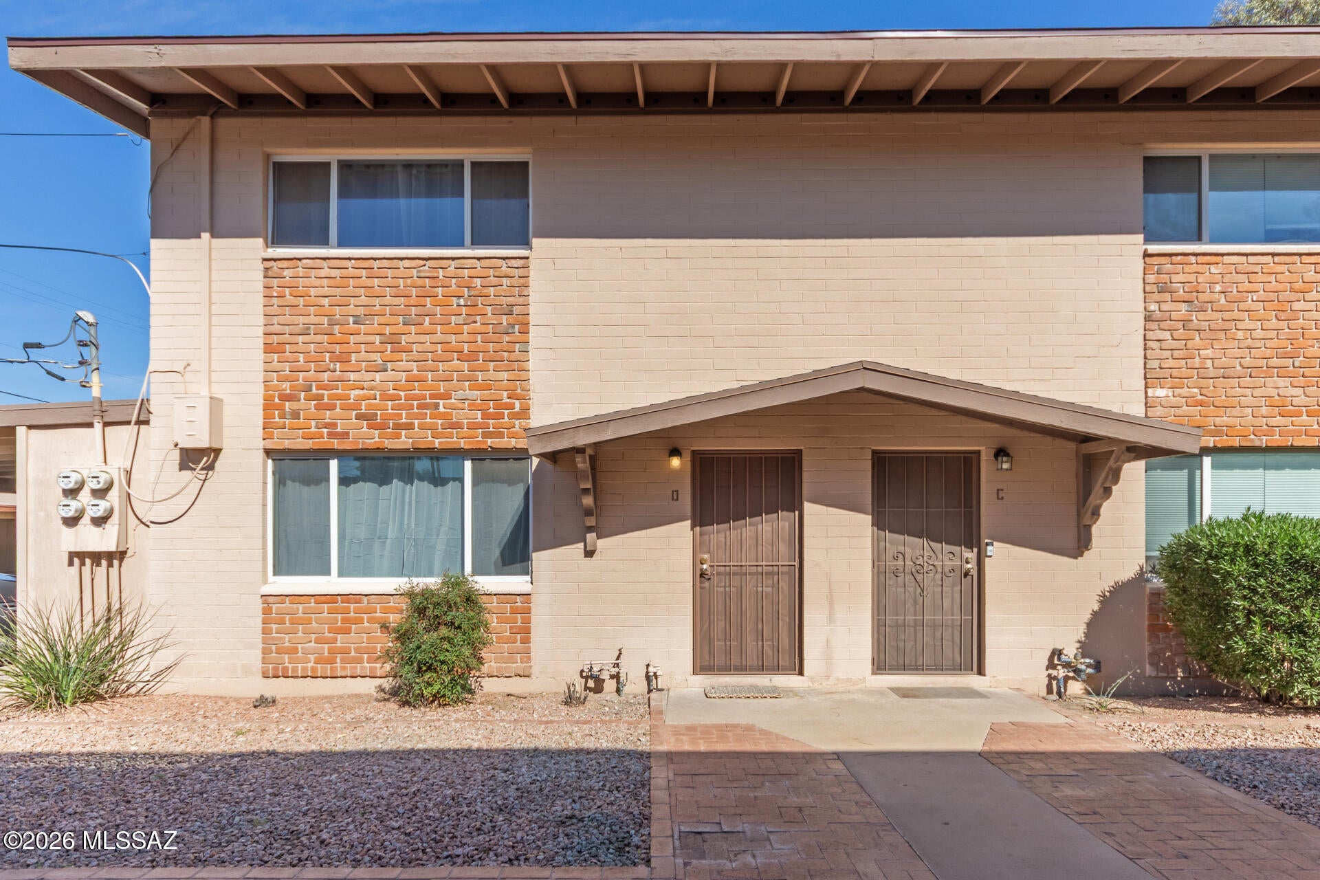 Just minutes from the University of Arizona, this beautifully updated two-story condo offers comfort, convenience, and a prime midtown Tucson location. Fresh paint, new flooring, new window coverings, and a brand-new water heater make this home move-in ready. The bright kitchen offers abundant cabinet space and flows into the inviting living area, which opens to a private patio. The main level also features a convenient half bath and a laundry room with the washer and dryer included. Upstairs, you'll find two spacious bedrooms, each with a walk-in closet, and a shared full bathroom. The unit also includes a dedicated covered parking space and a private storage unit for added convenience. Enjoy the community pool, with common area maintenance and garbage service included in the HOA. [More] Conveniently located near the University of Arizona, downtown Tucson, Trader Joe's, Himmel Park, shopping, dining, and more, this home is perfect for first-time buyers, students, downsizers, or investors looking for a great central Tucson location.