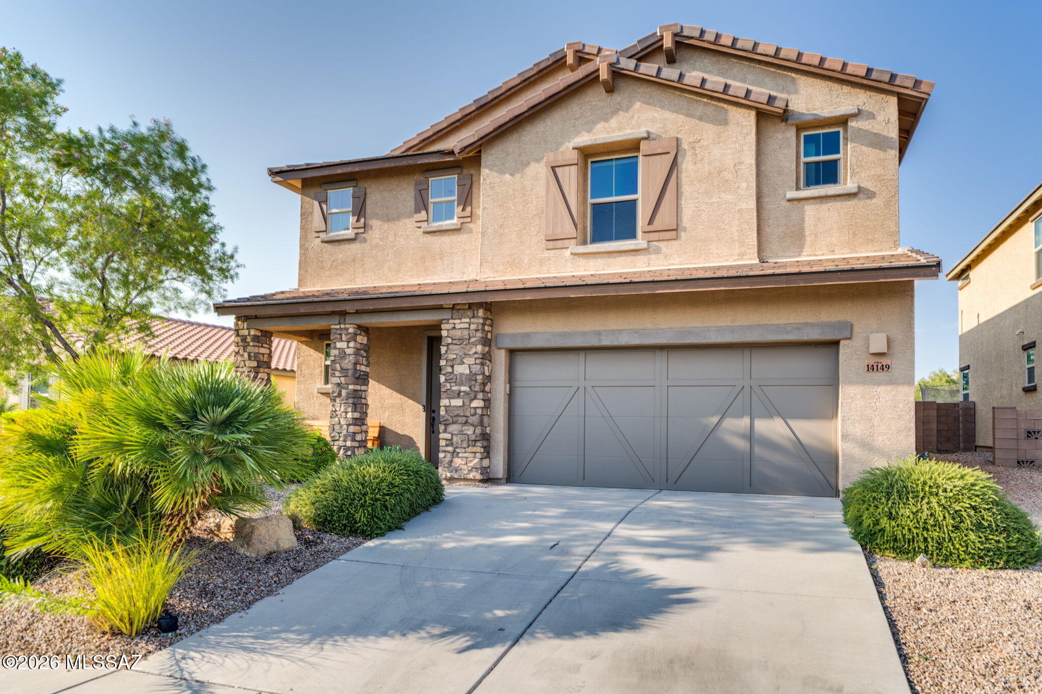 Come move in!  This former model home has over $150K in upgrades! This 4-bedroom, 2.5-bath, plus den, 2909 sq ft home features a bright, open floorplan, modern lighting, wood-look flooring and tandem 3 car garage. The gourmet kitchen offers a huge island, double oven, gas range with grill, stainless appliances, farmhouse sink, pantry and dining area with a built-in buffet area, perfect for serving or a beverage bar. Upstairs features a spacious loft, convenient laundry room and luxurious primary suite with mountain views, double vanity and custom tile. Enjoy the resort-style backyard with extended covered patio, built-in BBQ, pavers, turf and mature landscaping. Located in The Award-Winning Vail School District, close to shopping and dining.