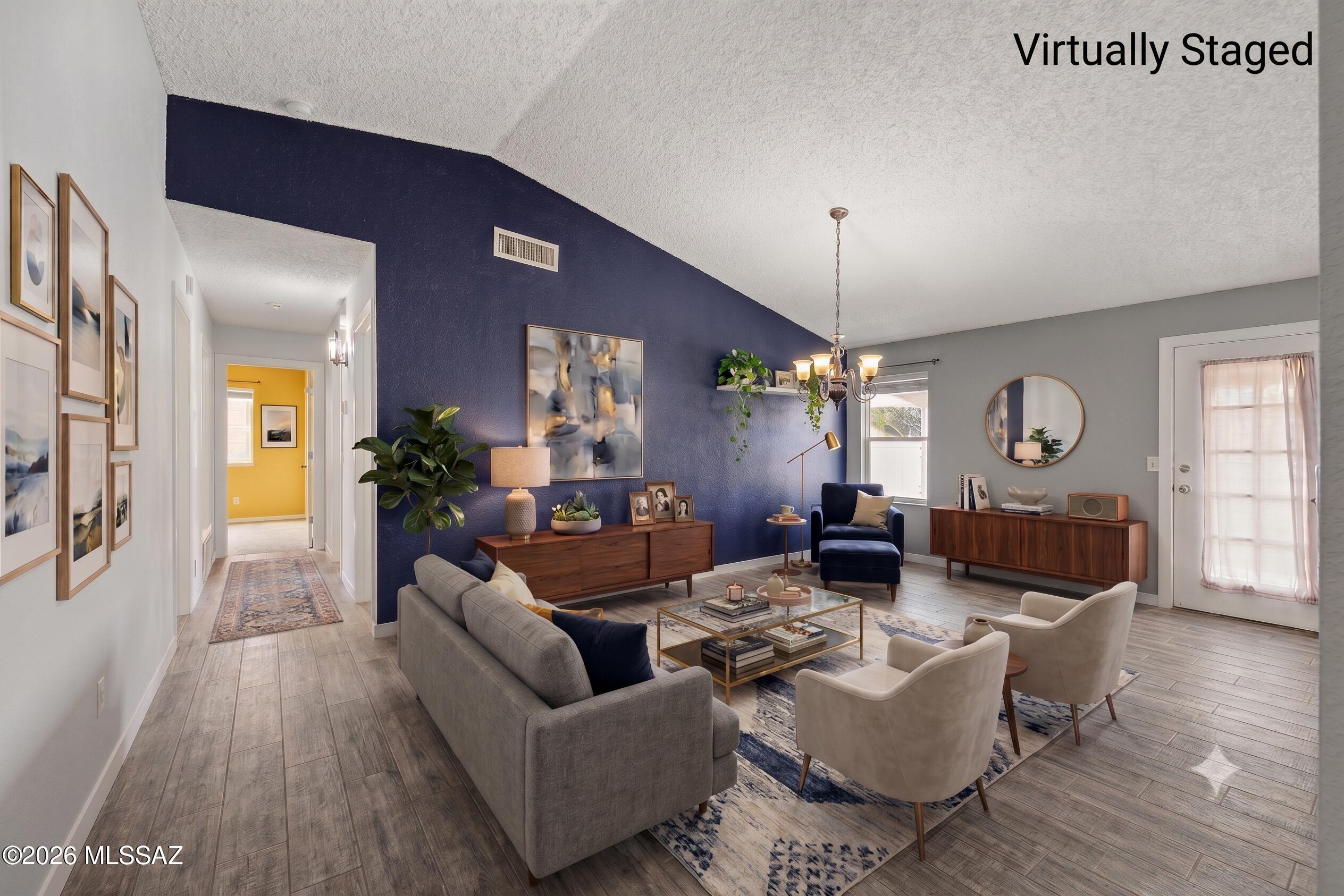 Seller will accept or counter offers between $300,000 - $322,000. 3D Matterport & Floor Plan available Call Listing Agent For Details Home, sweet home! This charming 3-bedroom, 2-bath residence welcomes you with a 2-car garage and a low-maintenance desert landscape. Inside, you'll find a serene living room with vaulted ceilings, a neutral palette, and wood-look flooring. Spend intimate moments with loved ones in the great room, perfect for relaxing evenings. The well-appointed kitchen comes with ample wood cabinetry, track lighting, stainless steel appliances, and a two-tier island with a breakfast bar for casual meals. The main bedroom features a private bathroom and a convenient walk-in closet. Unwind at the end of a long day in the backyard, which showcases a covered patio and sheds