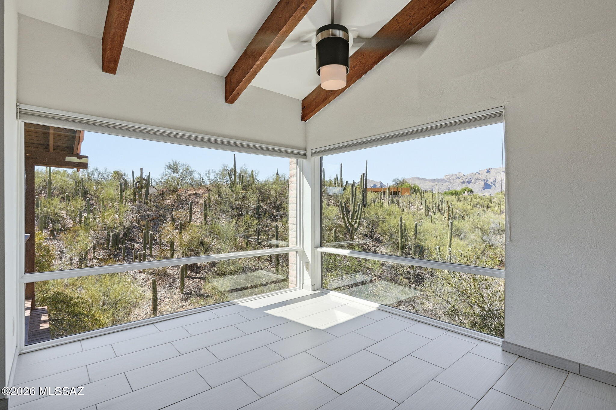 Stunning views of the Catalinas!! Upgrades galore! Beamed ceilings, gorgeous built-ins, end unit, views to the West and the North. With windows that are from the floor to the ceiling you feel like you're floating on air. Walk-in closets with custom cabinetry. This one has its own little gate to walk in the wash. The HOA pool is up on the hill and feels like your own private oasis. Property was a very successful Airbnb. Please reach out for more information.