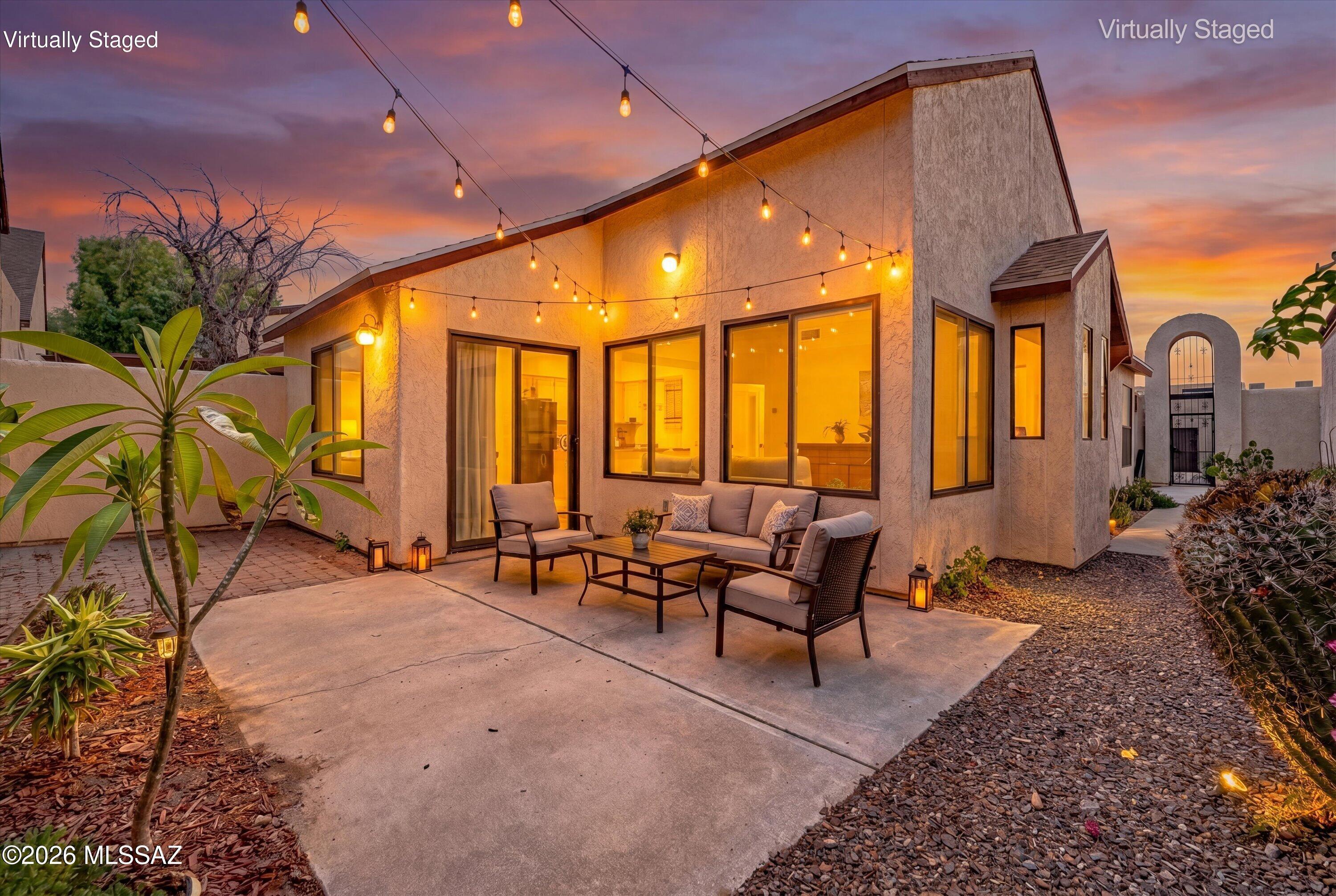 Move-in ready and thoughtfully updated, this charming single-family home offers soaring vaulted ceilings, abundant natural light, and an open-concept floor plan that lives larger than its 985 square feet. The remodeled kitchen features granite countertops, white cabinetry, subway tile backsplash, gas range, and a breakfast bar overlooking the spacious living and dining areas. Luxury vinyl plank flooring flows throughout, while the primary suite boasts a beautifully remodeled bath with a frameless glass walk-in shower and quartz vanity. Unique covered 2-car parking with garage door access, automatic opener, and multiple storage rooms. Enjoy access to community amenities including 2 pools, spa, fitness room, clubhouse, sports courts, playgrounds, and more.