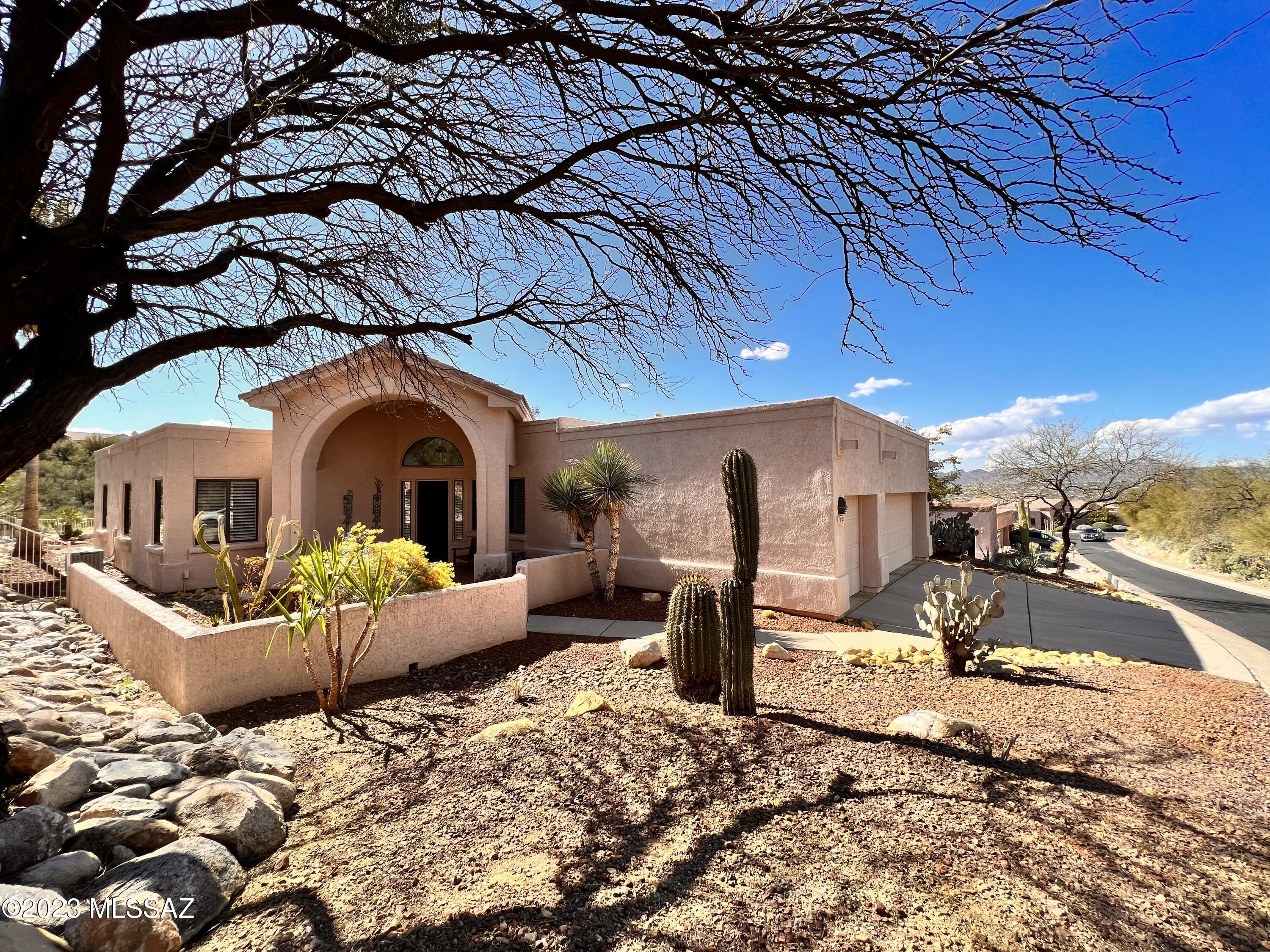 Beautiful 3bdr/2ba w/Den in gated/guarded community of La Reserve Oro Valley! Minutes to shopping, restaurants, hospital, hiking, biking and more! Gated courtyard w/stunning Catalina Mountain views. Inviting Living room w/fireplace, natural light and overlooks sparkling pool. Formal dining room, eat-in kitchen area, counter eating and gourmet kitchen w/New SS appliances, double oven, dual sink , tons of cabinet and counter space! Master bedroom w/Beehive FP, Pool access and bonus sitting area. Master bath features soaking tub, walk-in shower, huge closet, extra storage and more! Split bedroom floorplan, 3 car garage, mountain and city views. Relax in the spa or take a dip in your Zero edge pool w/stunning mountain/sunset/city views!
