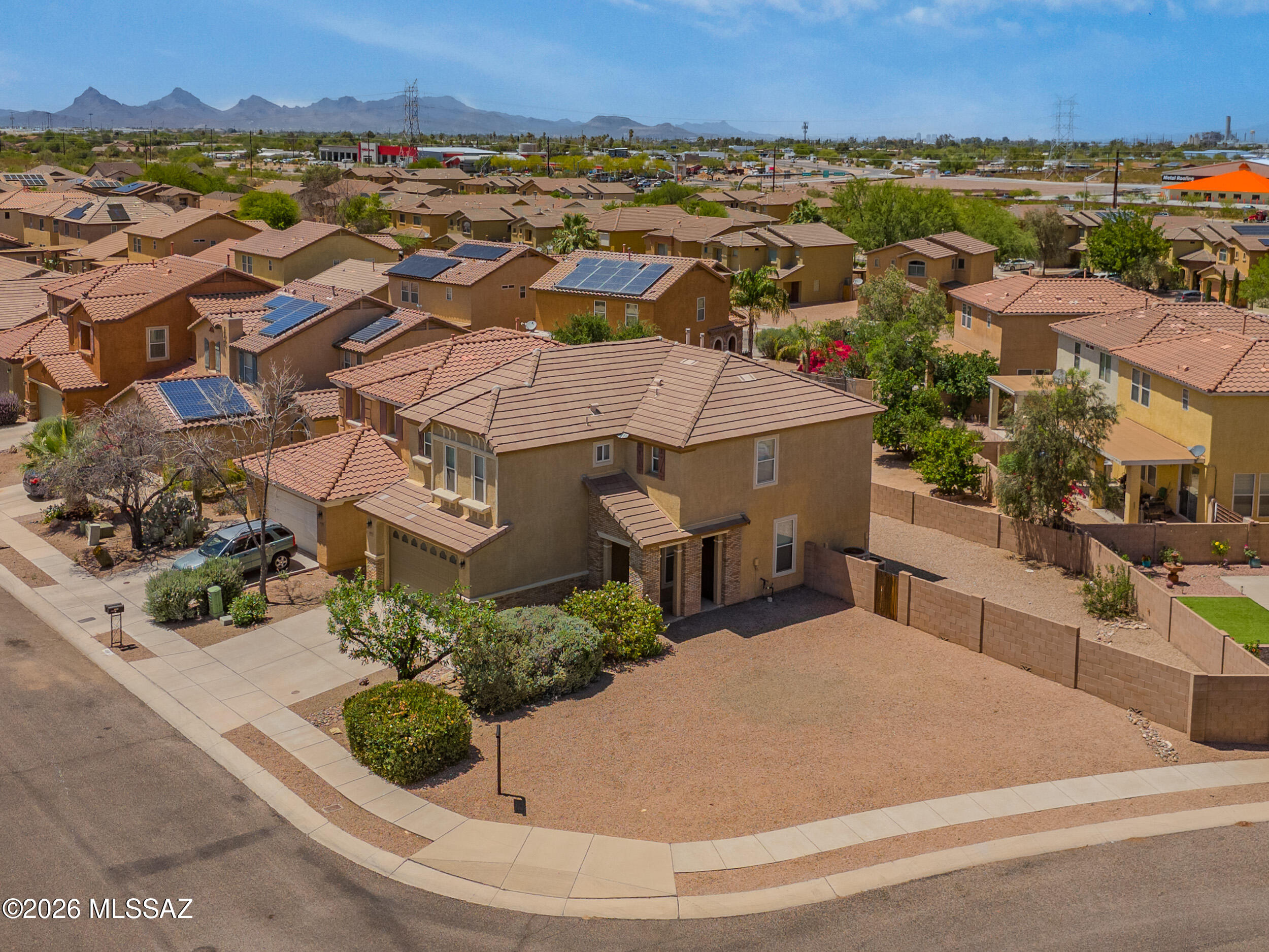 Located in desirable Valencia Reserve, this exceptionally well-maintained single-owner home offers 3 bedrooms, 2.5 bathrooms, and approx. 2,015 sq ft. Situated on the 2nd largest lot in the community, the property offers rare outdoor space and privacy. Built in 2007 and owned by the original owner since construction, the home features over $45,000 in original builder upgrades. Highlights include engineered hardwood oak flooring, crown moulding, upgraded oak stair rail, granite slab countertops, new appliances, upgraded cabinetry, raised bathroom vanities, radiant roof barrier, added insulation, soft water system, and recently replaced upstairs carpet. Move-in ready with a covered patio, expanded driveway, and convenient access to I-10, Downtown Tucson, Raytheon, DMAFB, shopping, and dining Original owner since construction in 2007. Over $45,000 in original builder upgrades. Features include engineered hardwood oak flooring, crown moulding, upgraded oak stair rail system, granite slab countertops, upgraded cabinetry, raised bathroom vanities, radiant roof barrier technology, added insulation, soft water system, expanded driveway, covered patio, side yard garage access door, and recently replaced upstairs carpeting. Functional floorplan includes spacious living areas, versatile upstairs loft/flex space, abundant natural light, and seamless flow between kitchen, dining, and living spaces. Oversized backyard offers additional privacy and flexibility rarely found within the community.